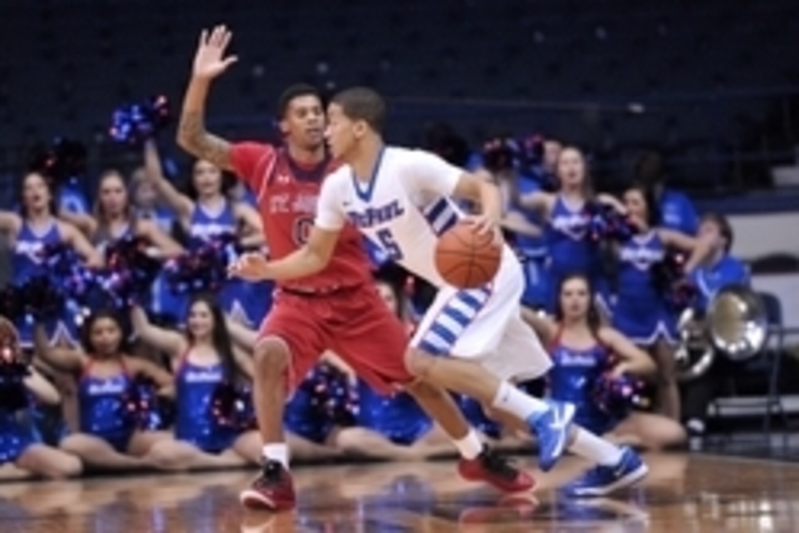 Jan 14, 2014; Rosemont, IL, USA; DePaul Blue Demons guard Billy Garrett Jr. (5) is defended by St. John's Red Storm guard Jamal Branch (0) during the first half at the Allstate Arena. Mandatory Credit: Rob Grabowski-USA TODAY Sports