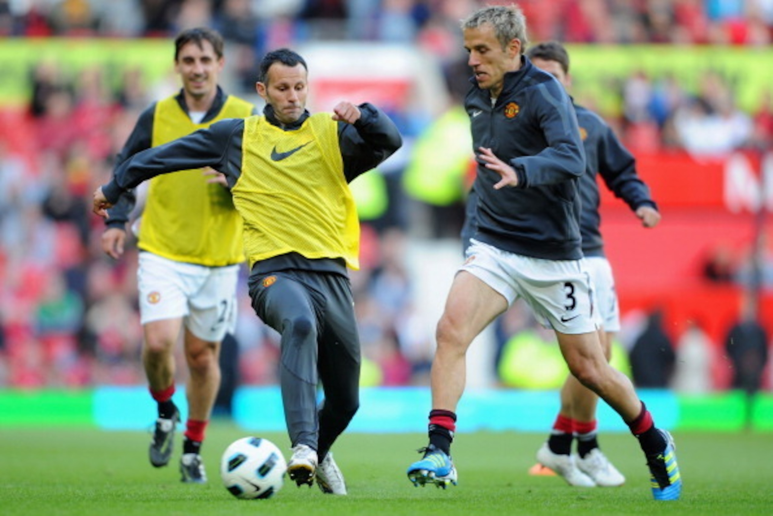 MANCHESTER, ENGLAND - MAY 24: Ryan Giggs warms up with Phil Neville during the Gary Neville Testimonial Match between Manchester United and Juventus at Old Trafford on May 24, 2011 in Manchester, England.  (Photo by Michael Regan/Getty Images)