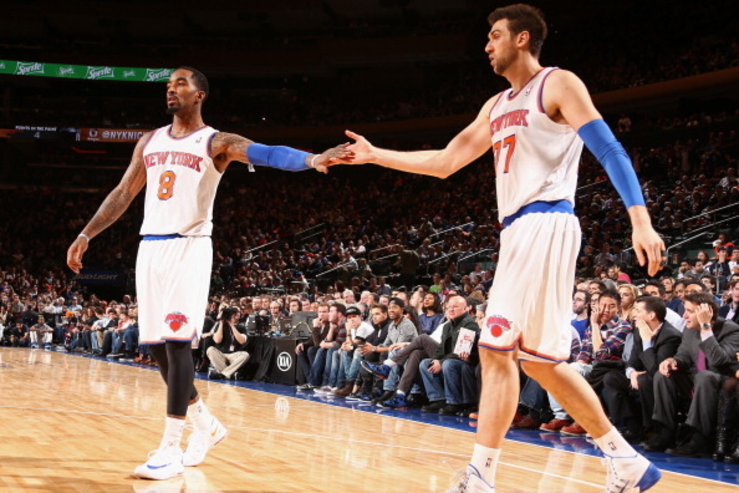 NEW YORK, NY - DECEMBER 6: J.R. Smith #8 of the New York Knicks high fives teammate Andrea Bargnani #77 of the New York Knicks during a game against the Orlando Magic at Madison Square Garden in New York City on December 6, 2013.  NOTE TO USER: User expre