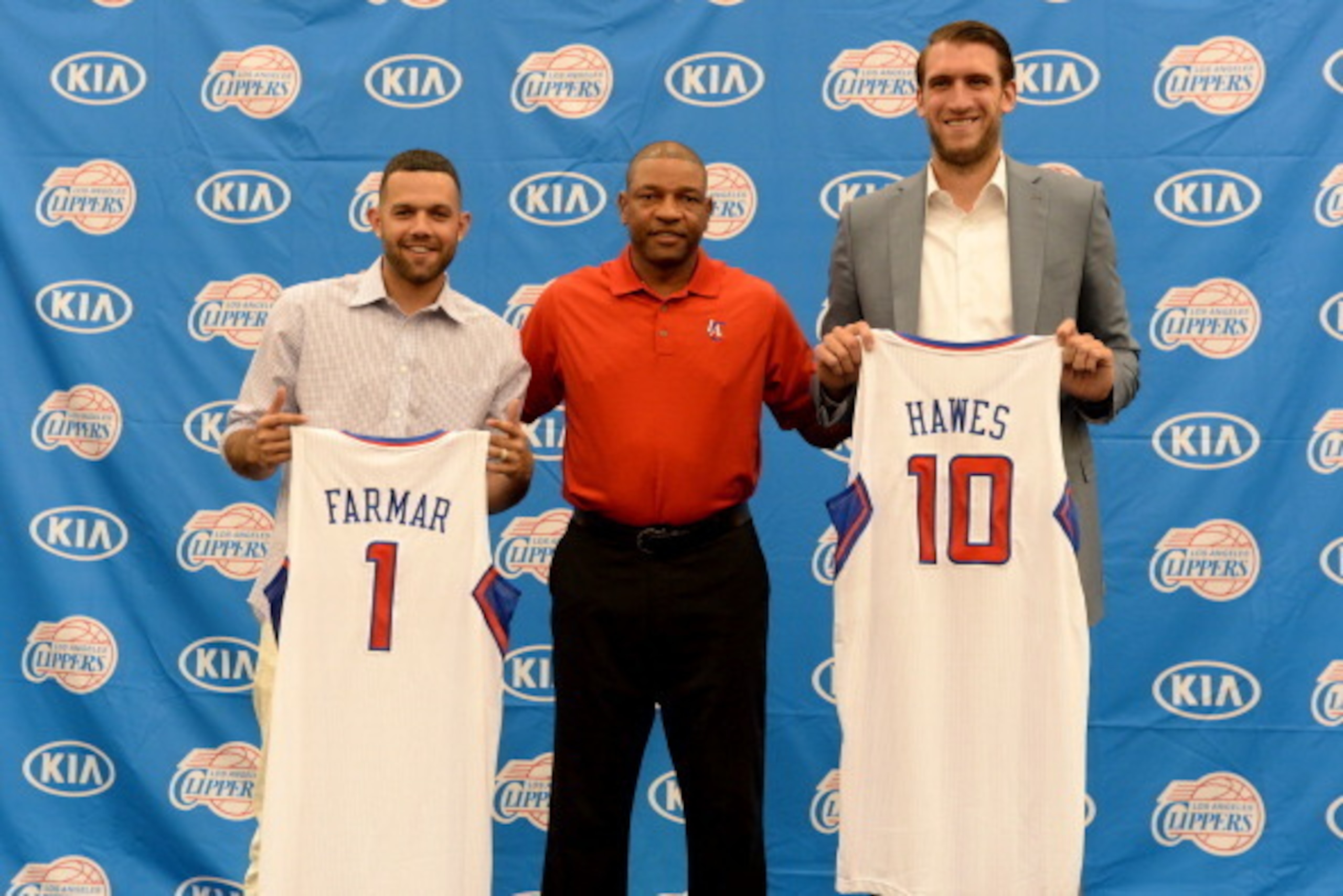 PLAYA VISTA, CA - JULY 10: Jordan Farmar #1, Doc Rivers, and Spencer Hawes #10 of the Los Angeles Clippers pose for a photo during a press conference on July 10, 2014 at the Los Angeles Clippers Training Facility in Playa Vista, California. NOTE TO USER: 