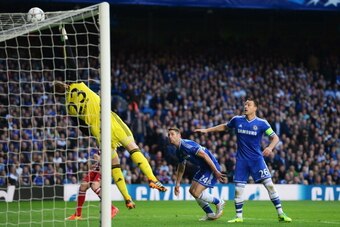 LONDON, ENGLAND - APRIL 30: John Terry (R) and Gary Cahill of Chelsea watch the ball hit the crossbar as Mark Schwarzer of Chelsea stretches in vain during the UEFA Champions League semi-final second leg match between Chelsea and Club Atletico de Madrid a