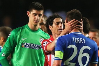 LONDON, ENGLAND - APRIL 30: Tiago of Club Atletico de Madrid consoles John Terry of Chelsea as Thibaut Courtois (L) looks on after the UEFA Champions League semi-final second leg match between Chelsea and Club Atletico de Madrid at Stamford Bridge on Apri