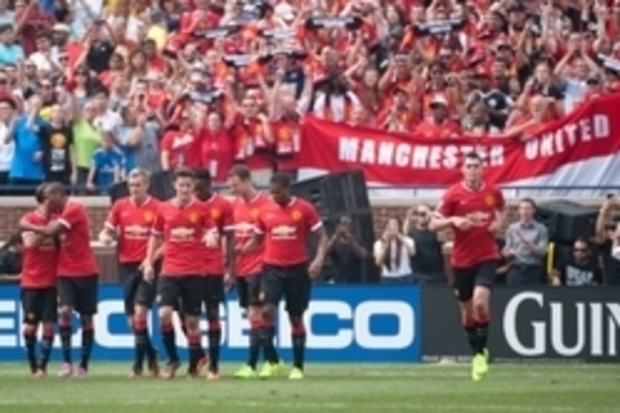 Aug 2, 2014; Ann Arbor, MI, USA; Manchester United players celebrate the goal of midfielder Ashley Young (18) during the first half against Real Madrid at Michigan Stadium. Mandatory Credit: Tim Fuller-USA TODAY Sports