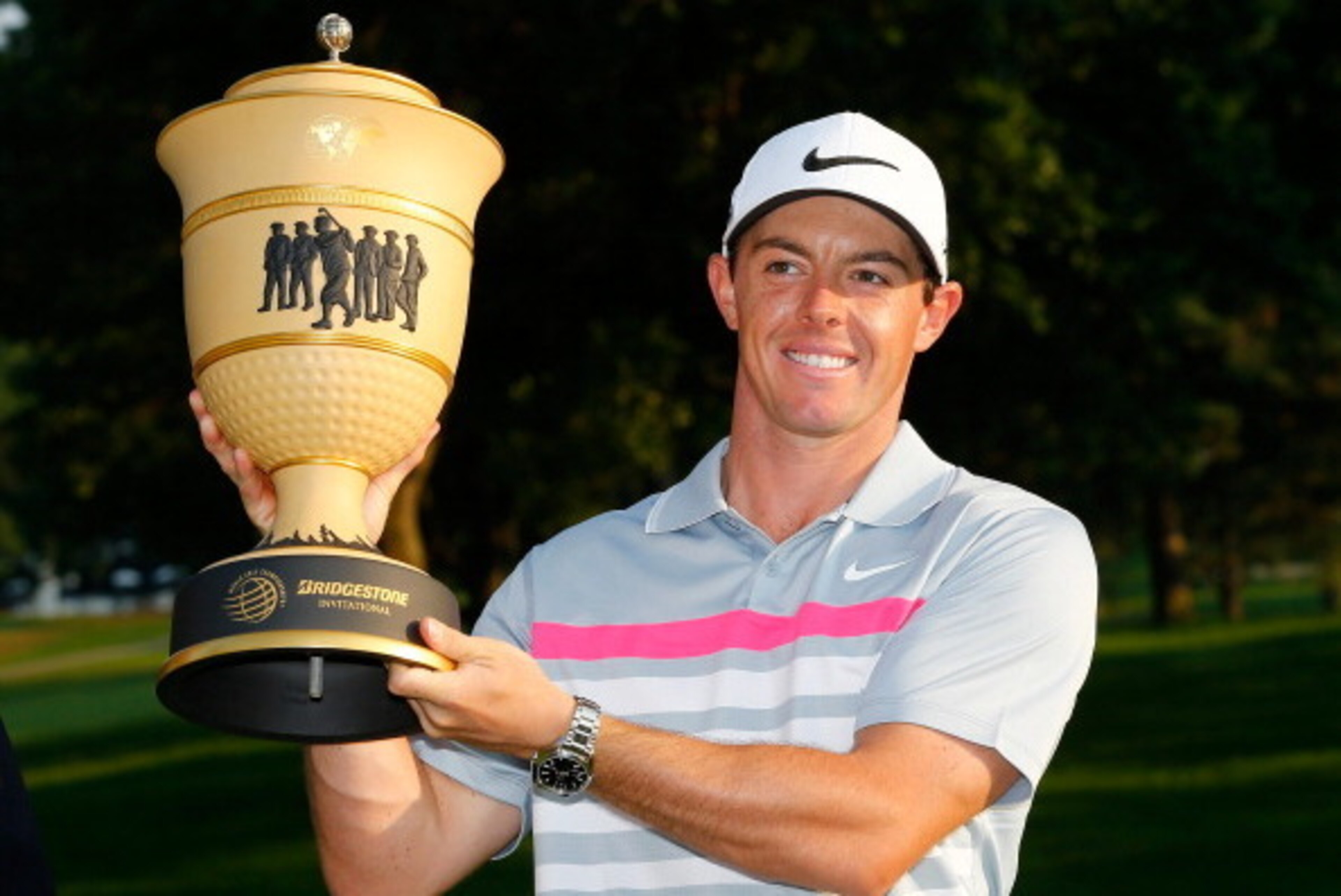 AKRON, OH - AUGUST 03:  Rory McIlroy of Northern Ireland holds the Gary Player Cup trophy after winning the World Golf Championships-Bridgestone Invitational with a score of -15 during the final round at Firestone Country Club South Course on August 3, 20