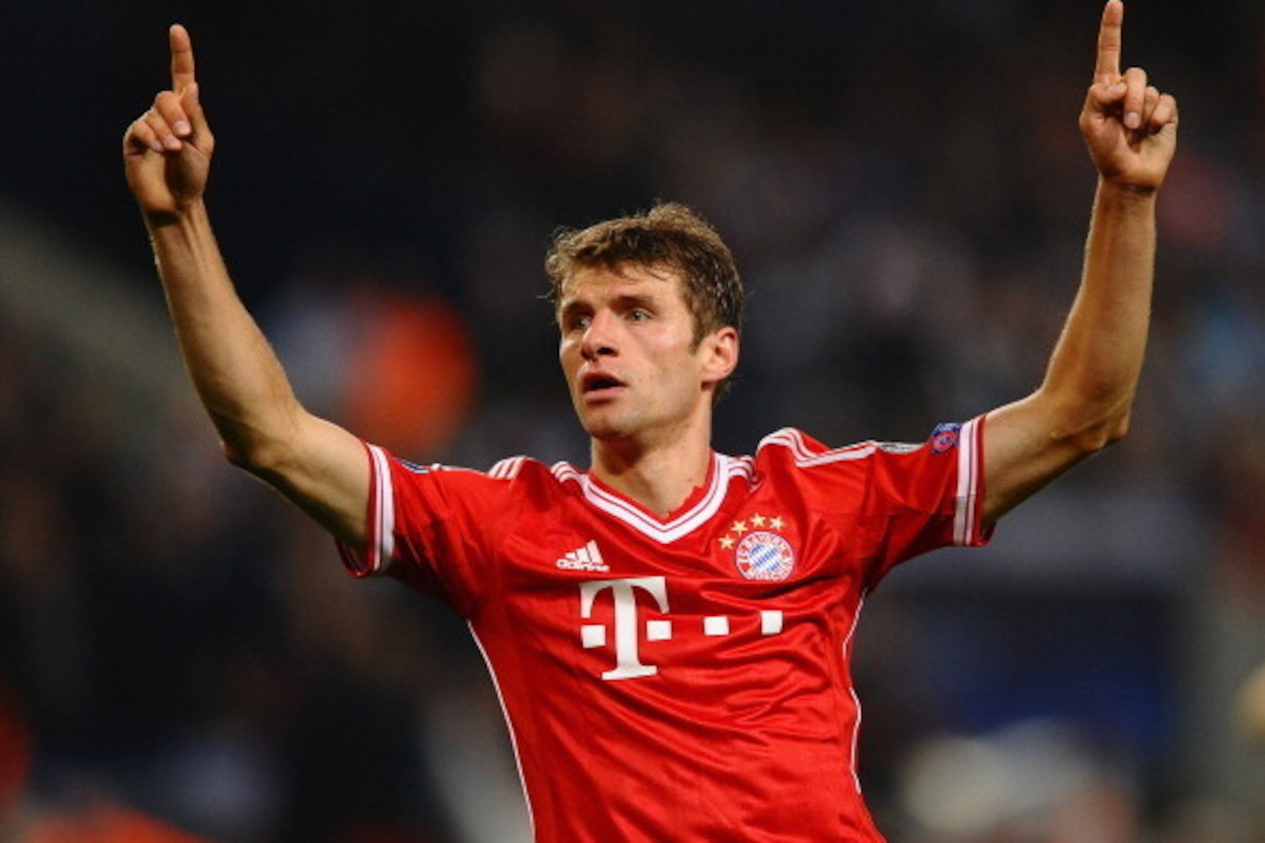 MANCHESTER, ENGLAND - OCTOBER 02:  Thomas Muller of FC Bayern Muenchen celebrates scoring the second goal during the UEFA Champions League Group D match between Manchester City and  FC Bayern Muenchen at Etihad Stadium on October 2, 2013 in Manchester, En