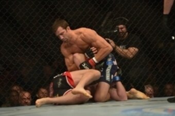 Apr 26, 2014; Baltimore, MD, USA;  Luke Rockhold (top) Tim Boetschat grapple during the first round at Baltimore Arena. Rockhold defeated Boetsch by submission in the first round Mandatory Credit: Tommy Gilligan-USA TODAY Sports
