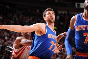 HOUSTON, TX - JANUARY 3:  Andrea Bargnani #77 of the New York Knicks battles for the rebound against the Houston Rockets on January 3, 2014 at the Toyota Center in Houston, Texas. NOTE TO USER: User expressly acknowledges and agrees that, by downloading a