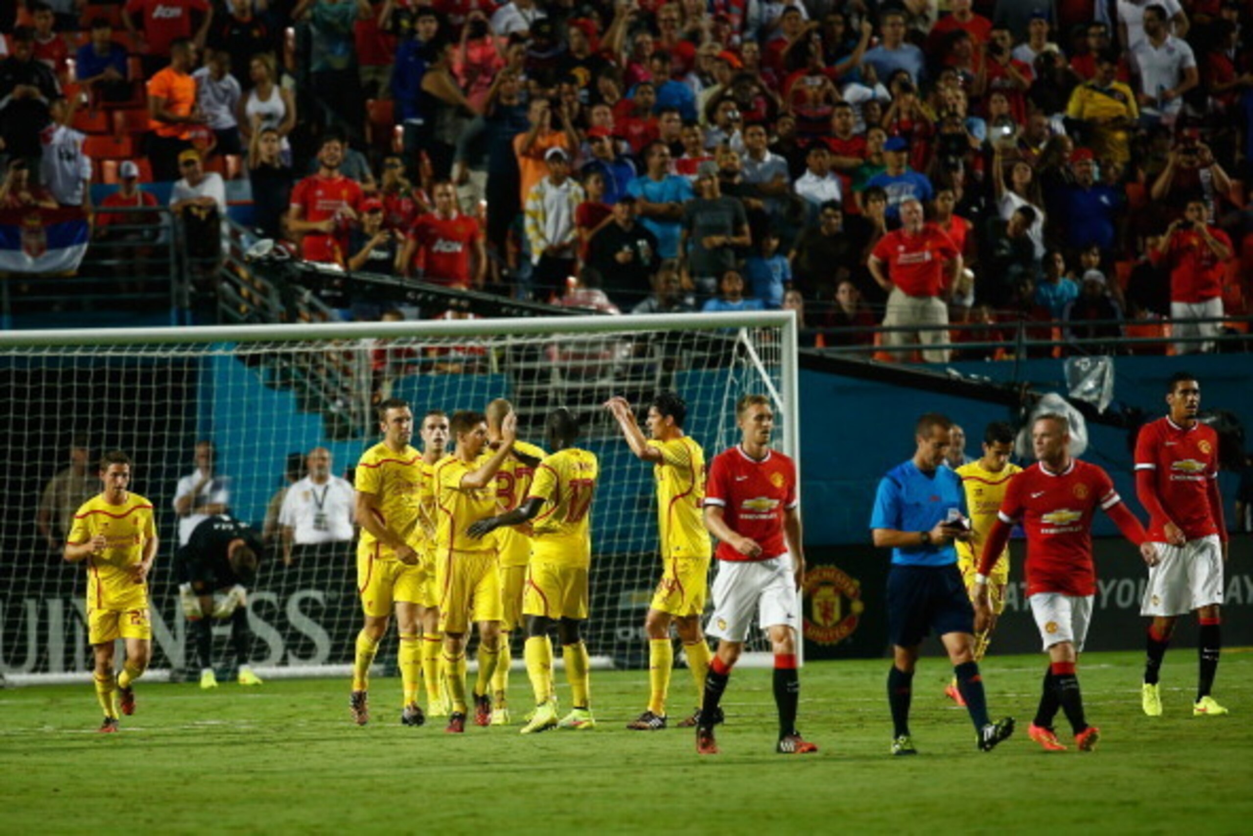 MIAMI GARDENS, FL - AUGUST 04:  Steven Gerrard #8 of Liverpool is congratulated by his teammates for scoring a penalty kick against Manchester United in the first half of the Guinness International Champions Cup 2014 Final at Sun Life Stadium on August 4,