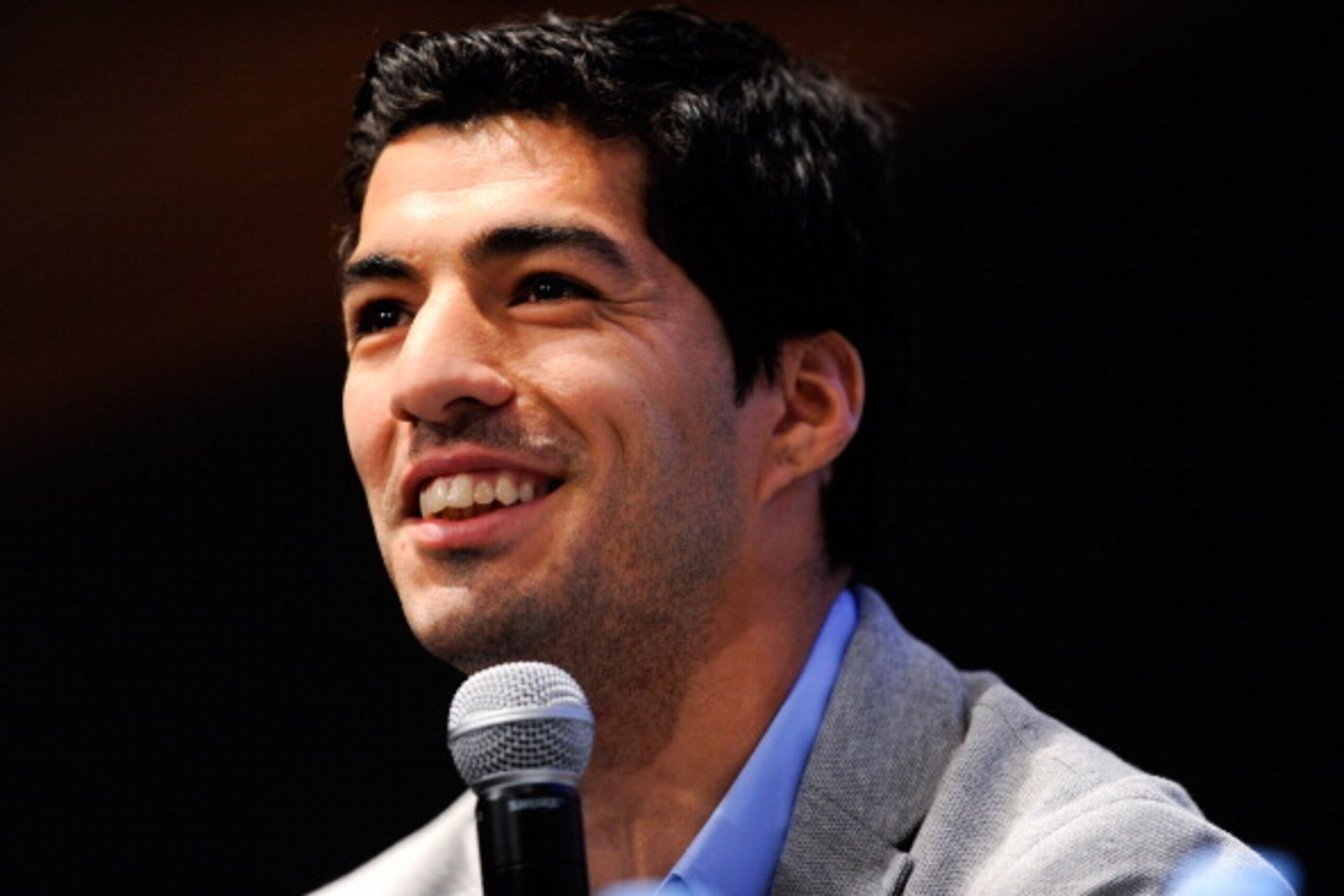 BARCELONA, SPAIN - MAY 14:  Luis Suarez of Liverpool faces the media during the presentation as new Ambassador for 888poker on May 14, 2014 in Barcelona, Spain.  (Photo by David Ramos/Getty Images)