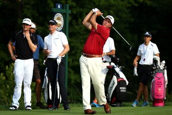 LOUISVILLE, KY - AUGUST 05:  Phil Mickelson of the United States hits a tee shot as Keegan Bradley of the United States and Brendan Steele of the United States look on during a practice round prior to the start of the 96th PGA Championship at Valhalla Gol