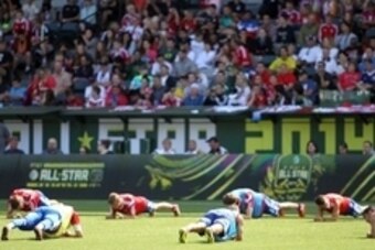 Aug 5, 2014; Portland, OR, USA; Bayern Munich players do push-ups during a training session in advance of the 2014 MLS All Star Game at Providence Park. Mandatory Credit: Craig Mitchelldyer-USA TODAY Sports