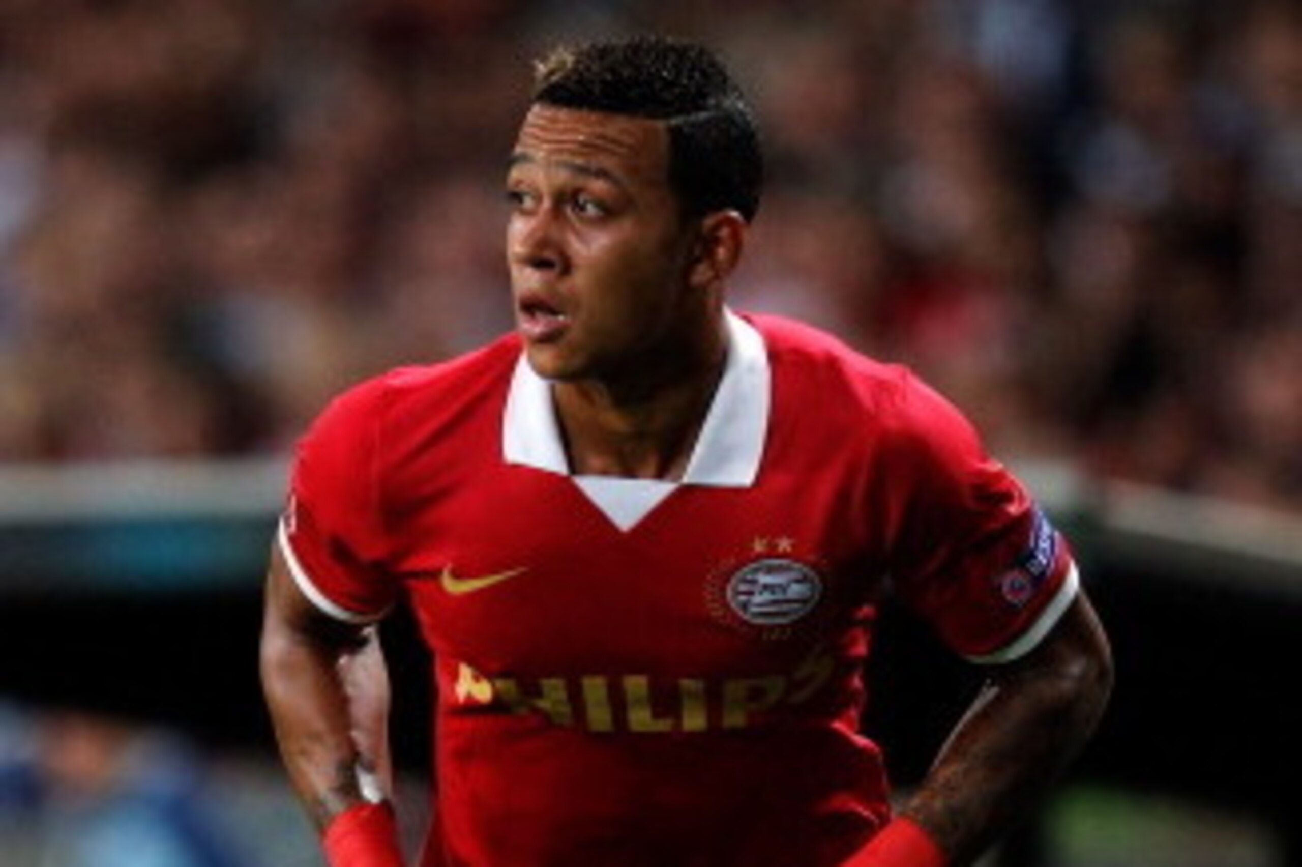 EINDHOVEN, NETHERLANDS - AUGUST 20:  Memphis Depay of PSV in action during the UEFA Champions League Play-off First Leg match between PSV Eindhoven and AC Milan at PSV Stadion on August 20, 2013 in Eindhoven, Netherlands.  (Photo by Dean Mouhtaropoulos/Ge