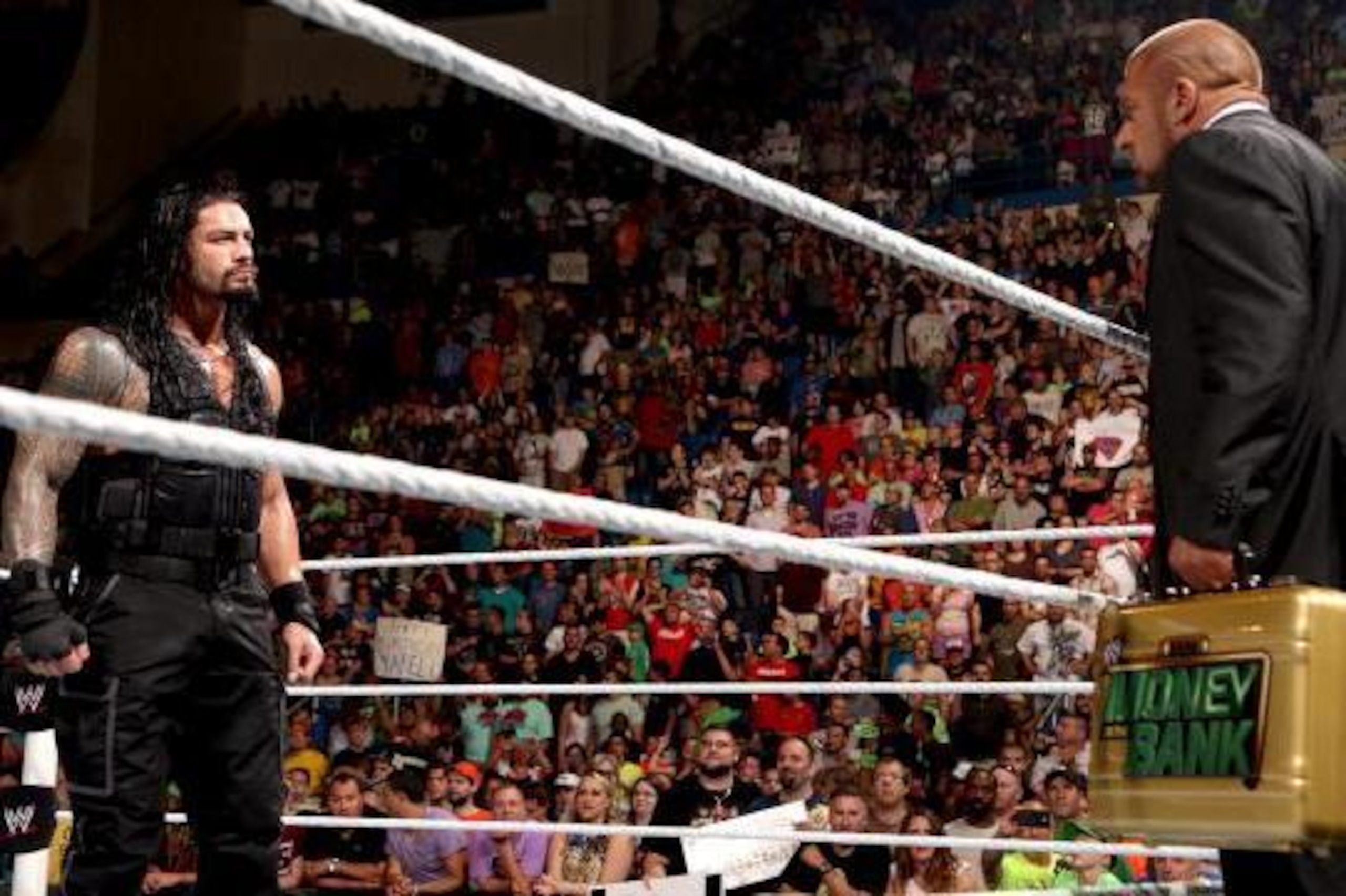 Reigns stares down Triple H