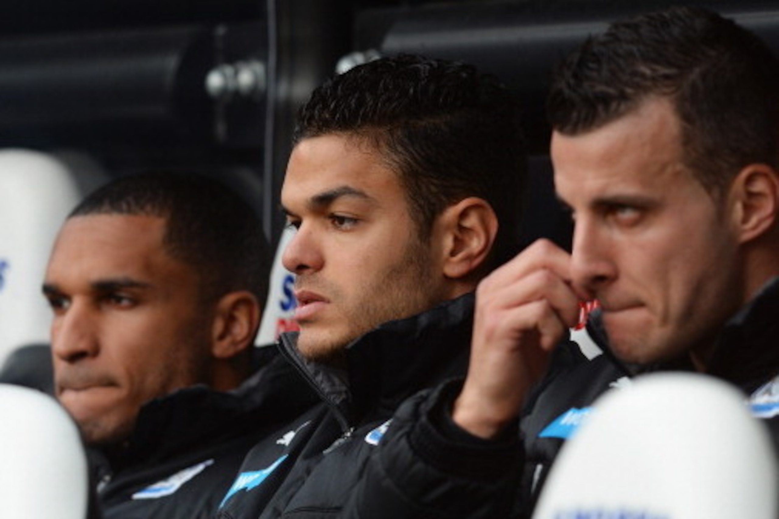 NEWCASTLE UPON TYNE, ENGLAND - MARCH 22:  Hatem Ben Arfa (C) of Newcastle United looks on from the bench during the Barclays Premier League match between Newcastle United and Crystal Palace at St James' Park on March 22, 2014 in Newcastle upon Tyne, Engla