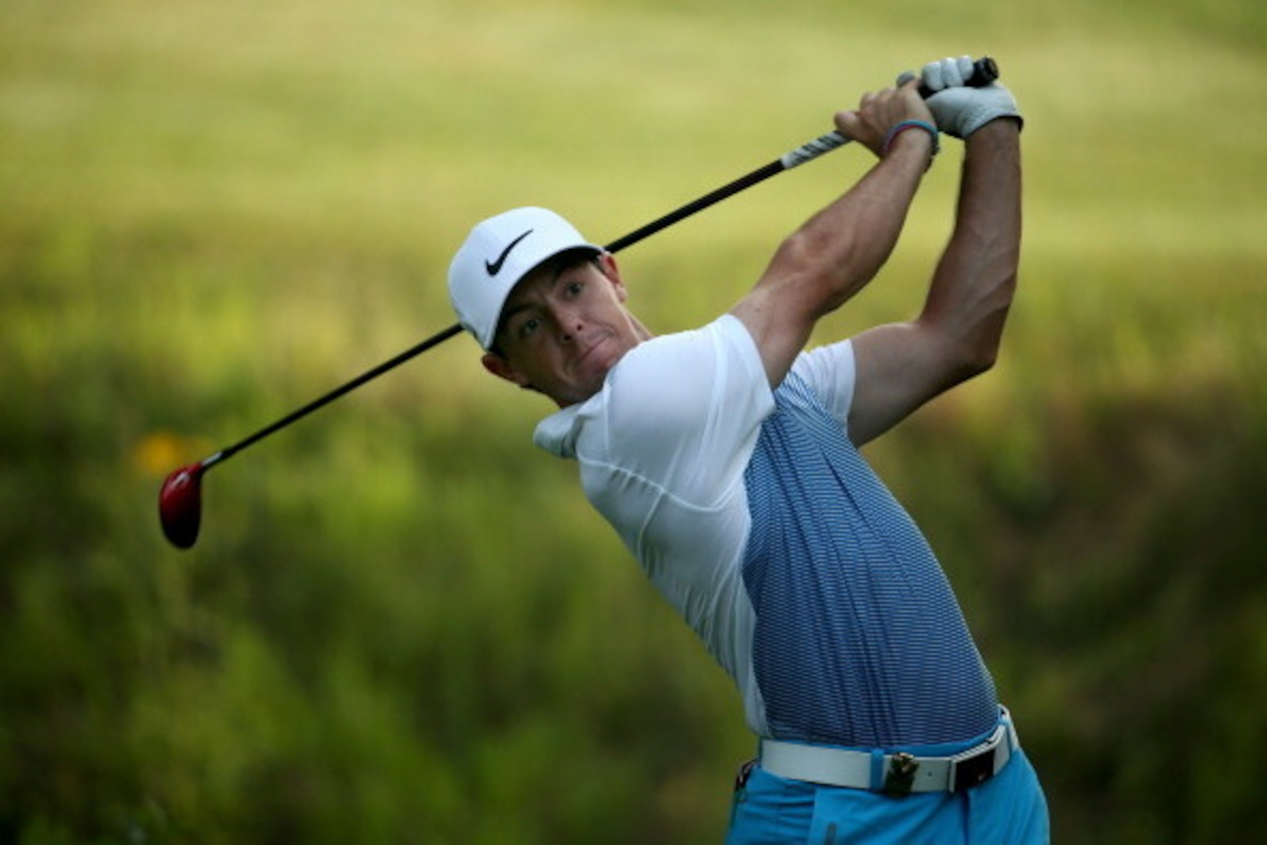 LOUISVILLE, KY - AUGUST 06:  Rory McIlroy of Northern Ireland hits a tee shot during a practice round prior to the start of the 96th PGA Championship at Valhalla Golf Club on August 6, 2014 in Louisville, Kentucky.  (Photo by Warren Little/Getty Images)