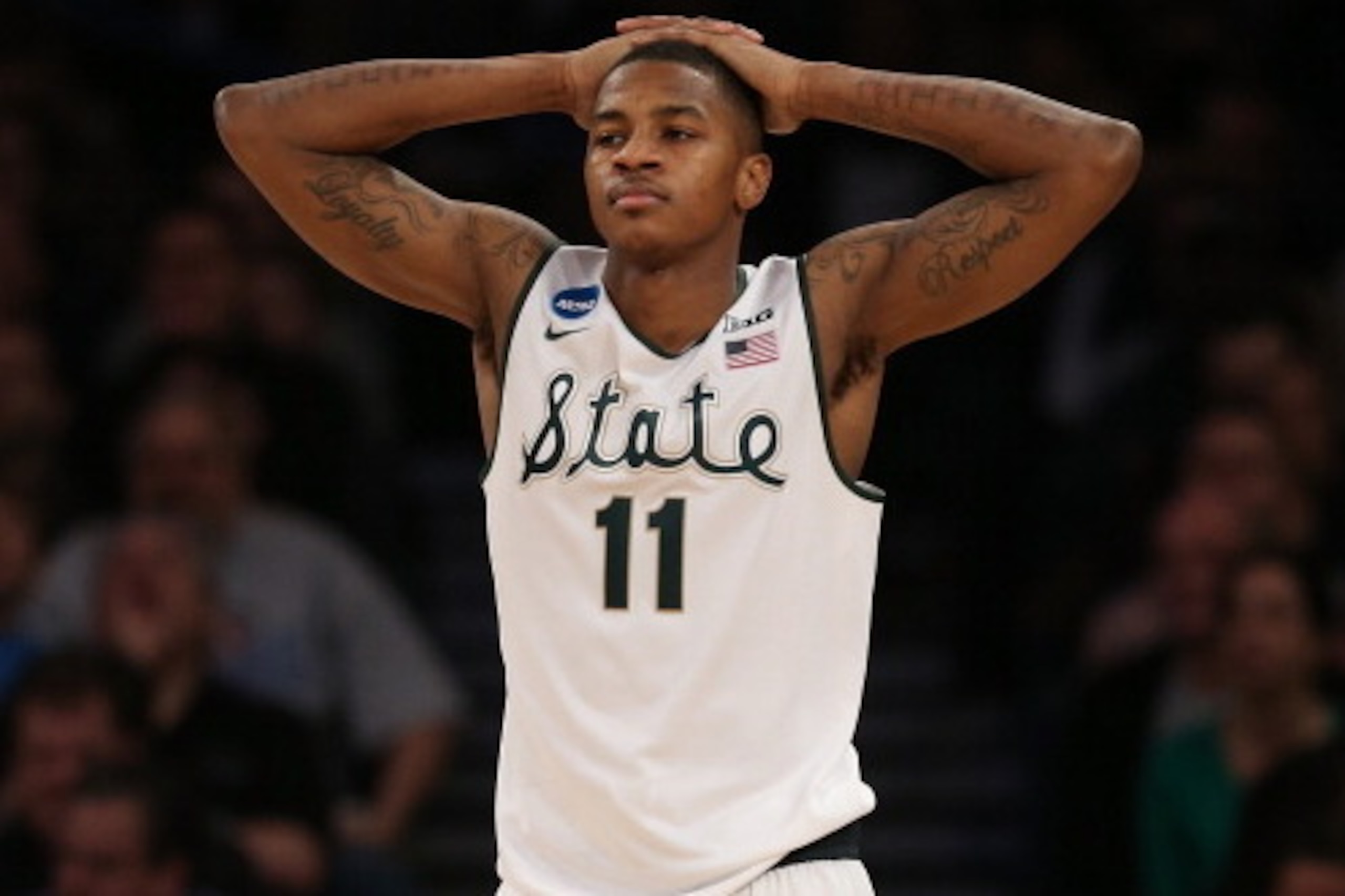 NEW YORK, NY - MARCH 30:  Keith Appling #11 of the Michigan State Spartans reacts against the Connecticut Huskies during the East Regional Final of the 2014 NCAA Men's Basketball Tournament at Madison Square Garden on March 30, 2014 in New York City.  (Ph