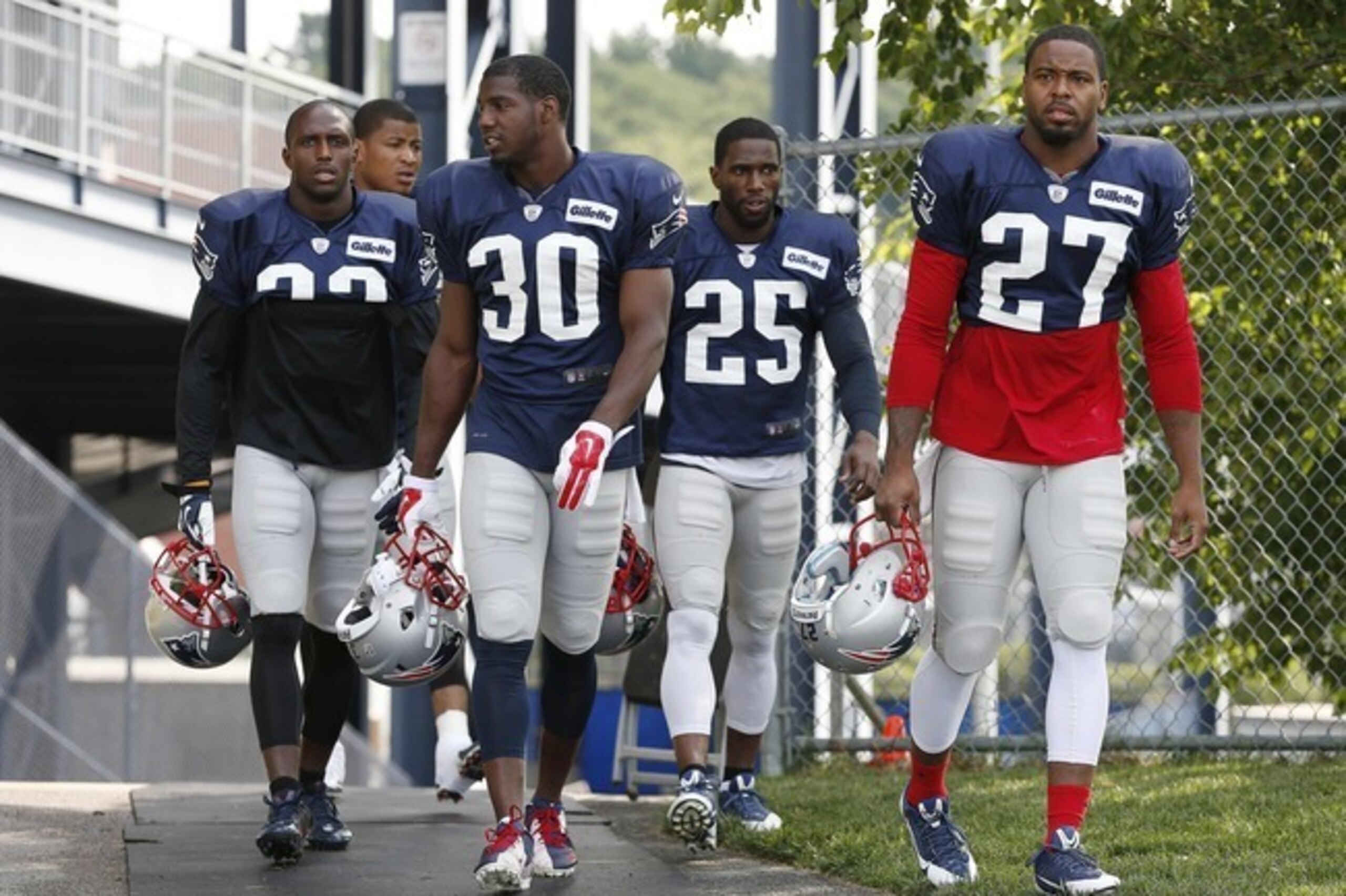 Patriots FS Devin McCourty (32, left) and SS Duron Harmon (30, middle) share an alma mater and are working on sharing a brain as a duo on the back end.