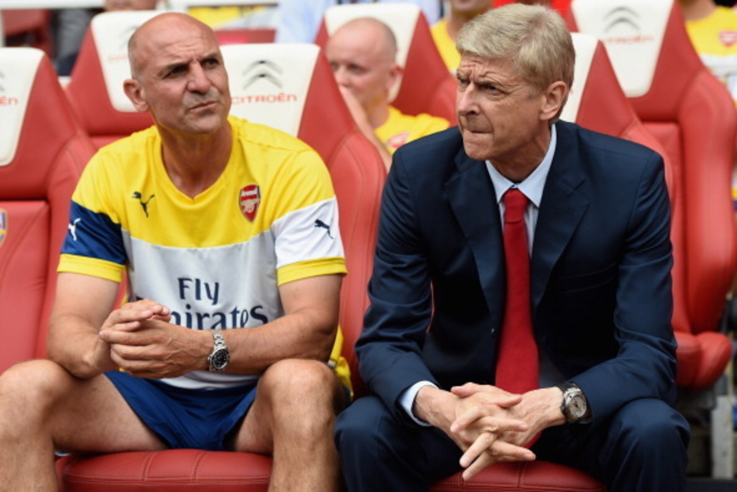 LONDON, ENGLAND - AUGUST 02: Arsenal assistant manager Steve Bould and manager Arsene Wenger look on during the Emirates Cup match between Arsenal and Benfica at the Emirates Stadium on August 2, 2014 in London, England.  (Photo by Michael Regan/Getty Ima