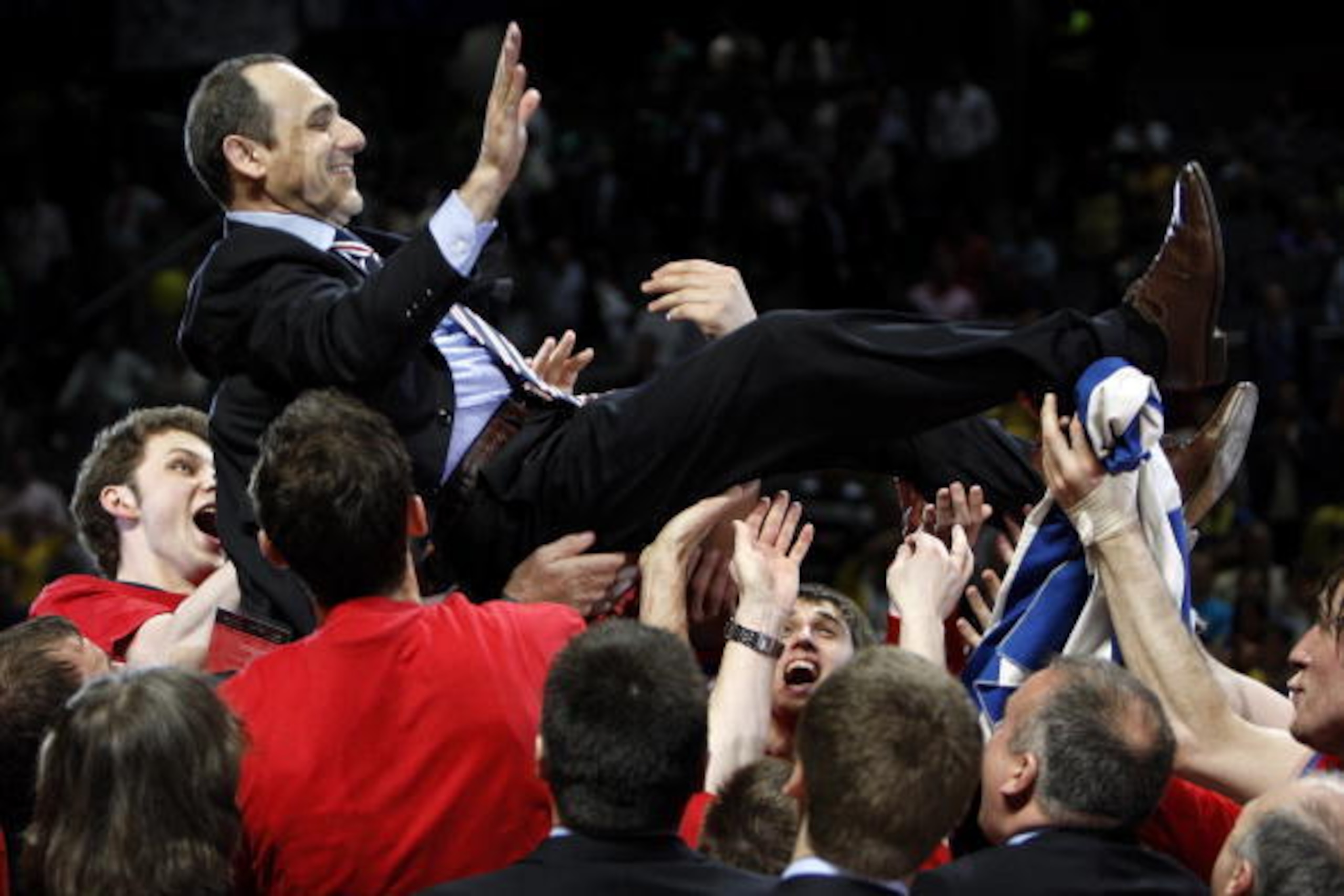 MADRID, SPAIN - MAY 04:  Head Coach Ettore Messina of CSKA Moscow is hoisted up by his players as they celebrate victory at the end of the Euroleague Final Four final basketball match between Maccabi Elite and CSKA Moscow, at the Palacio de Deportes on Ma