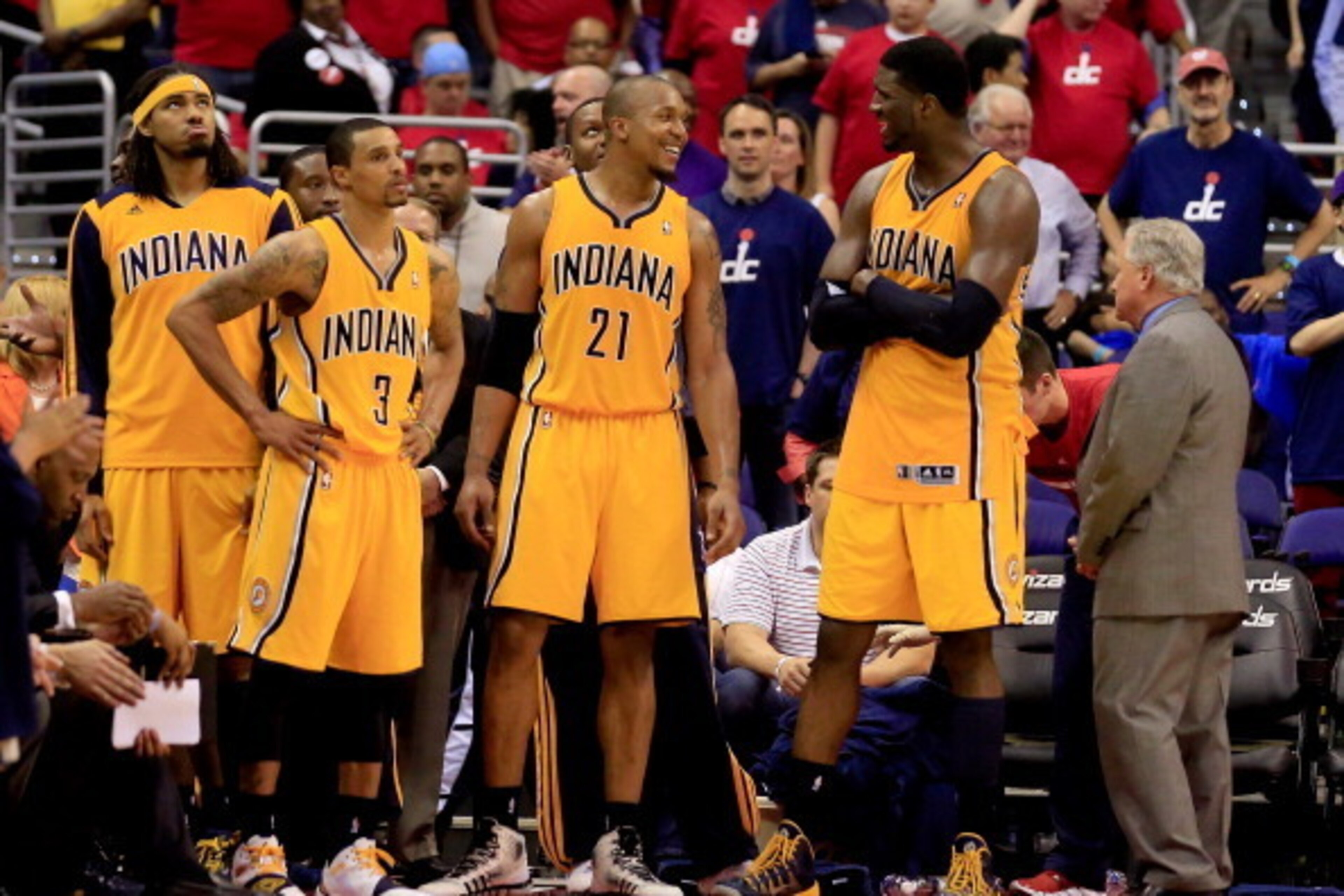 WASHINGTON, DC - MAY 15:  George Hill #3, David West #21 and Roy Hibbert #55 of the Indiana Pacers celebrate in the final minutes of their win over the Washington Wizards during Game Six of the Eastern Conference Semifinals during the 2014 NBA Playoffs at