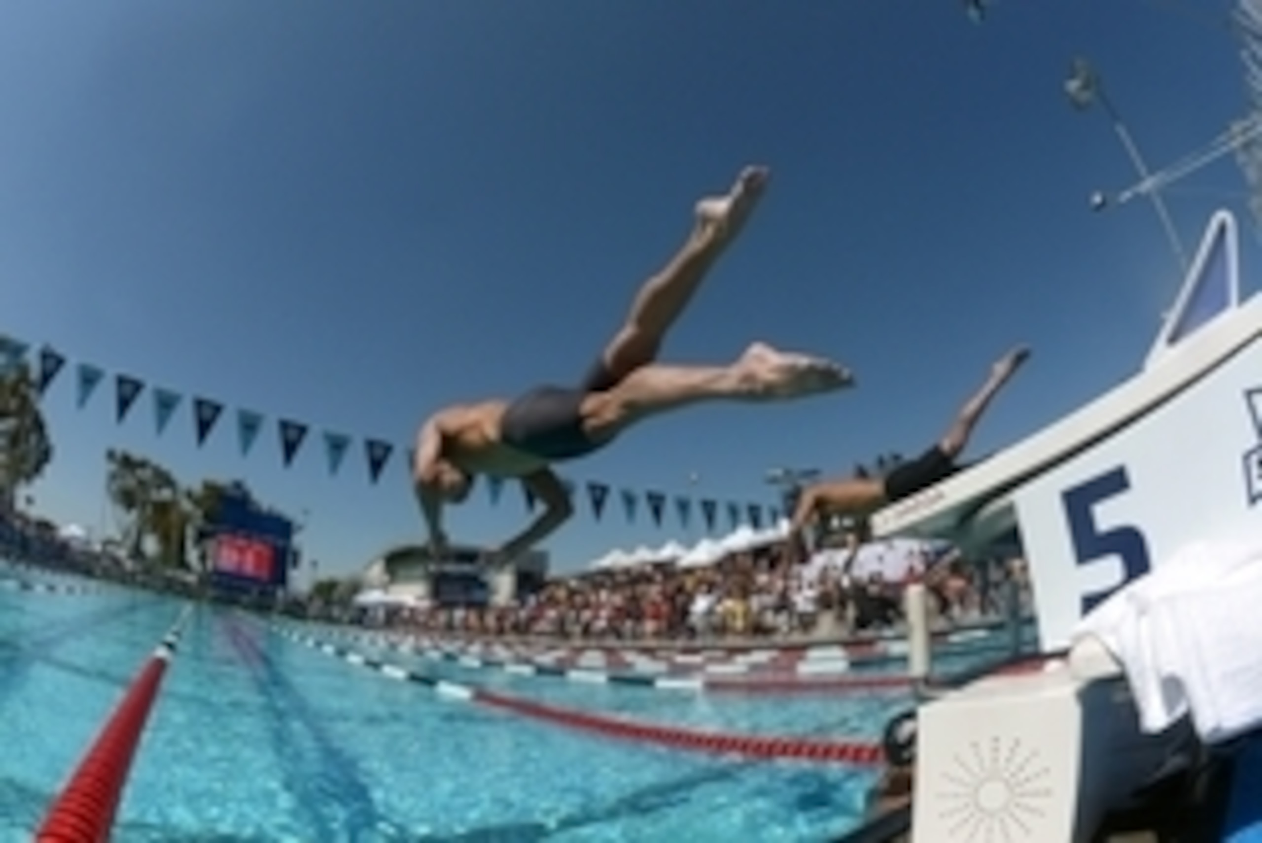 Aug 6, 2014; Irvine, CA, USA; Michael Phelps dives into the pool at the start of a 100m freestyle heat in  the 2014 USA National Championships at William Woollett Jr. Aquatics Complex. Mandatory Credit: Kirby Lee-USA TODAY Sports