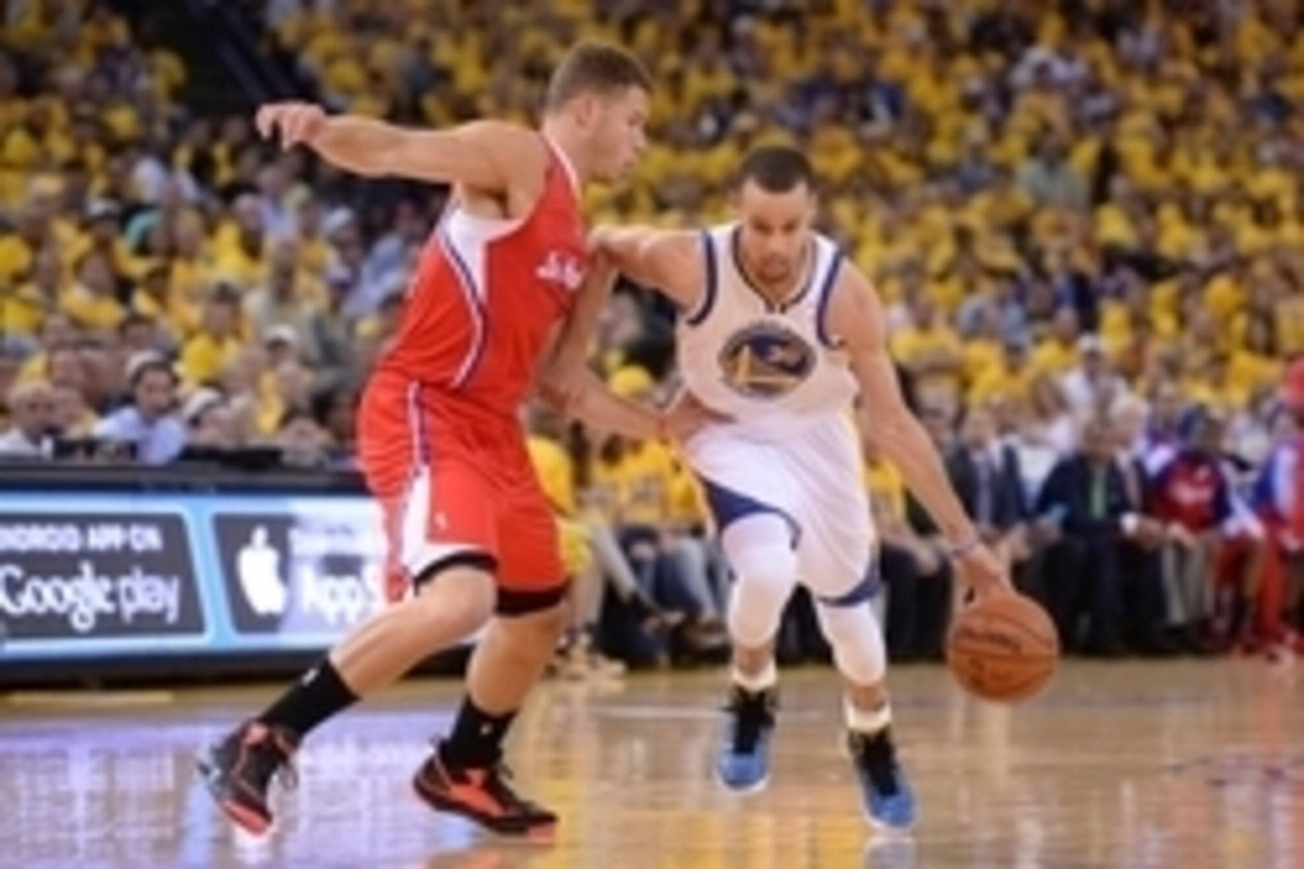 May 1, 2014; Oakland, CA, USA; Golden State Warriors guard Stephen Curry (30) dribbles the basketball against Los Angeles Clippers forward Blake Griffin (32, left) during the first quarter in game six of the first round of the 2014 NBA Playoffs at Oracle 