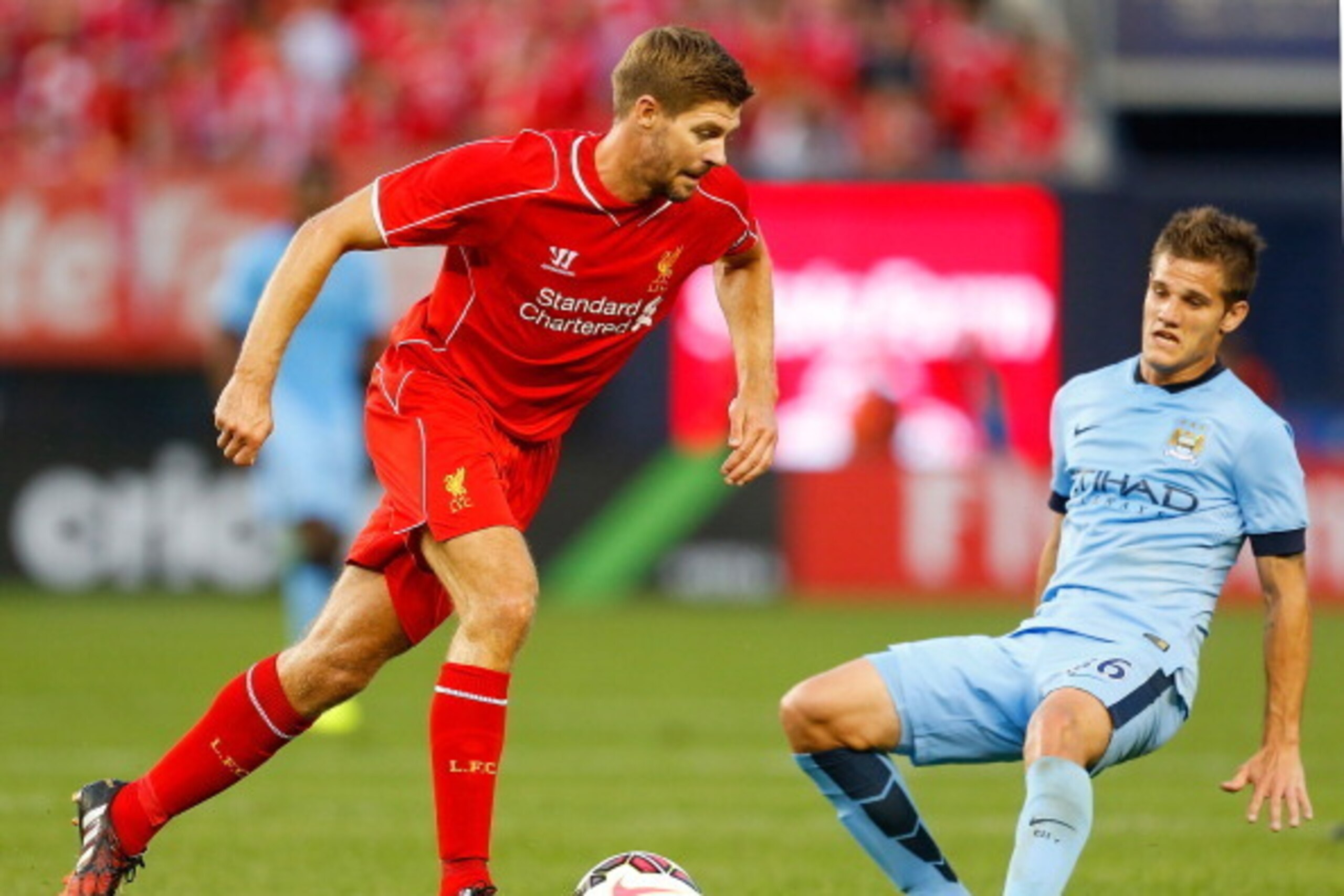 NEW YORK, NY - JULY 30:  Steven Gerrard #8 of Liverpool carries the ball against Manchester City during the International Champions Cup 2014 at Yankee Stadium on July 30, 2014 in the Bronx borough of New York City.  (Photo by Mike Stobe/Getty Images)