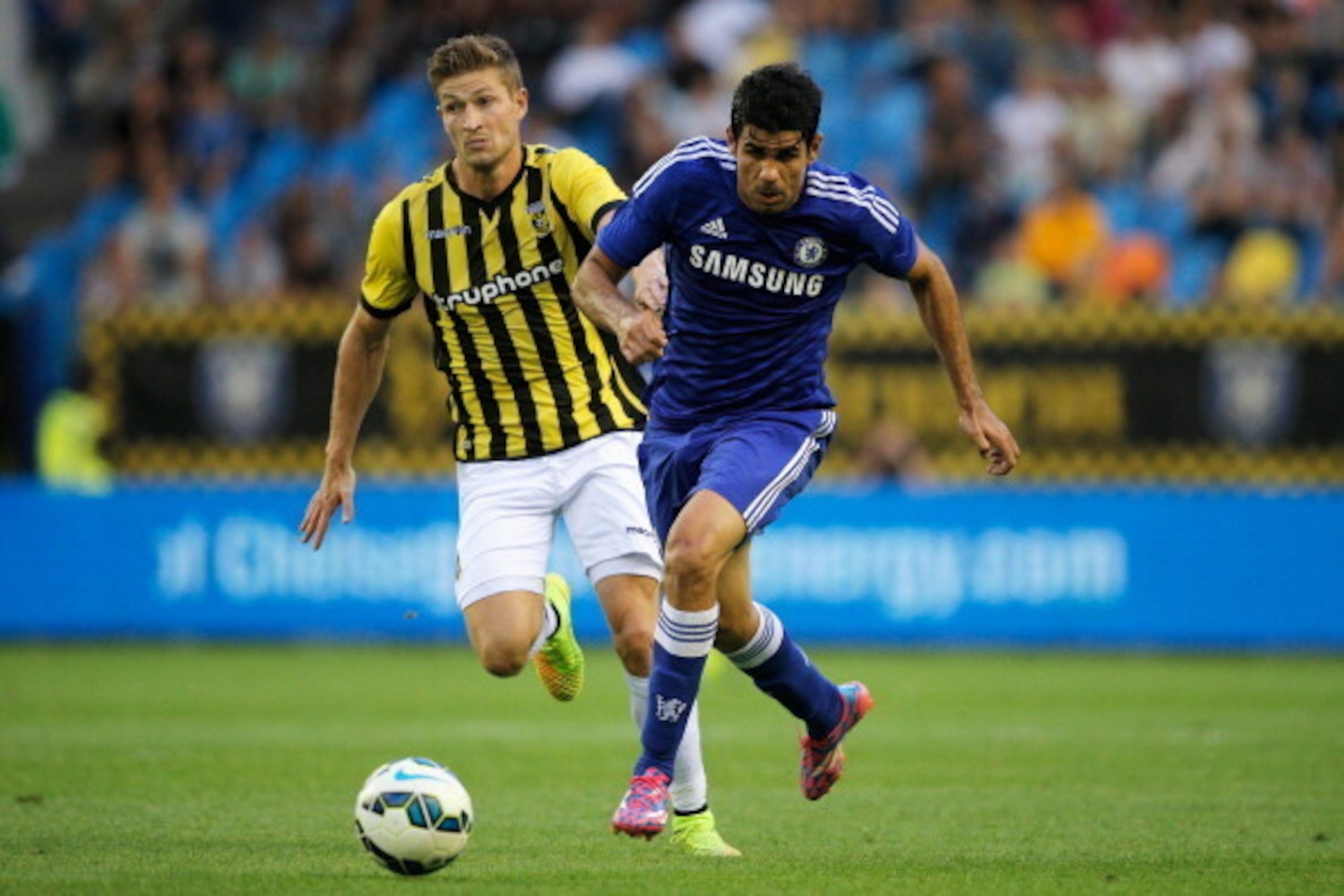 ARNHEM, NETHERLANDS - JULY 30:  Diego Costa of Chelsea gets past Jan-Arie van der Heijden of Vitesse during the pre season friendly match between Vitesse Arnhem and Chelsea at the Gelredome Stadium on July 30, 2014 in Arnhem, Netherlands.  (Photo by Dean 