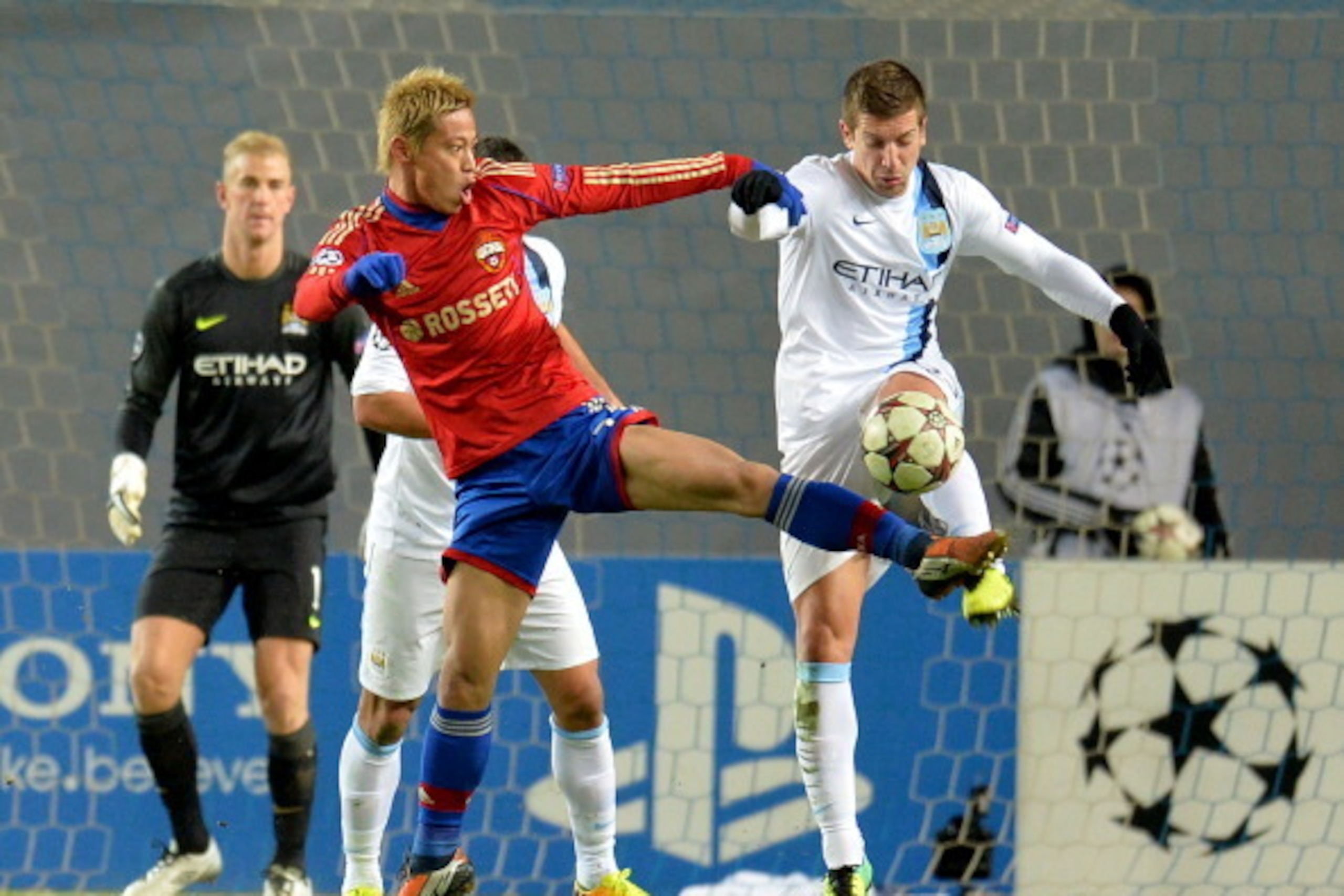 KHIMKI, RUSSIA - OCTOBER 23: Keisuke Honda (L) of PFC CSKA Moscow in action against Matija Nastasic of Manchester City FC during the UEFA Champions League Group D match between PFC CSKA Moscow and Manchester City FC at the Arena Khimki Stadium on October 