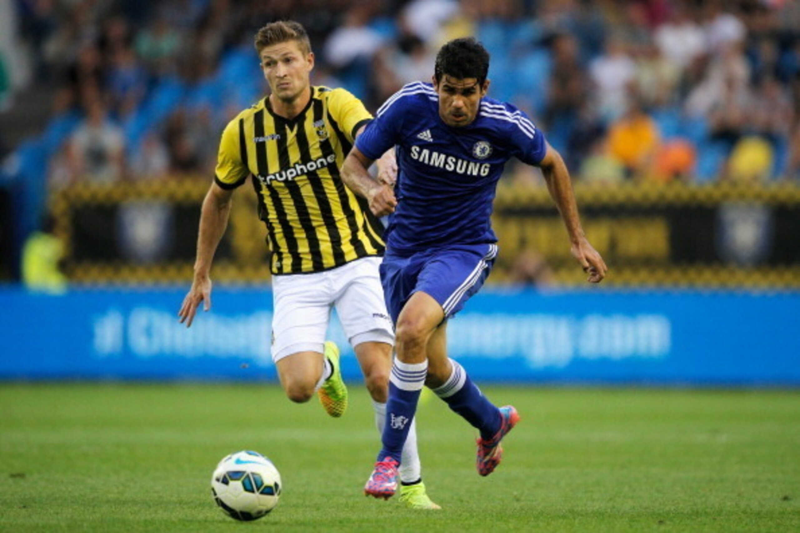 ARNHEM, NETHERLANDS - JULY 30:  Diego Costa of Chelsea gets past Jan-Arie van der Heijden of Vitesse during the pre season friendly match between Vitesse Arnhem and Chelsea at the Gelredome Stadium on July 30, 2014 in Arnhem, Netherlands.  (Photo by Dean 