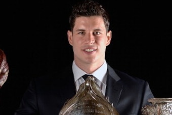 LAS VEGAS, NV - JUNE 24:  Sidney Crosby of the Pittsburgh Penguins poses with the Ted Lindsay Award, the Hart Memorial Trophy, and the Art Ross Trophy during the 2014 NHL Awards at the Encore Theater at Wynn Las Vegas on June 24, 2014 in Las Vegas, Nevada