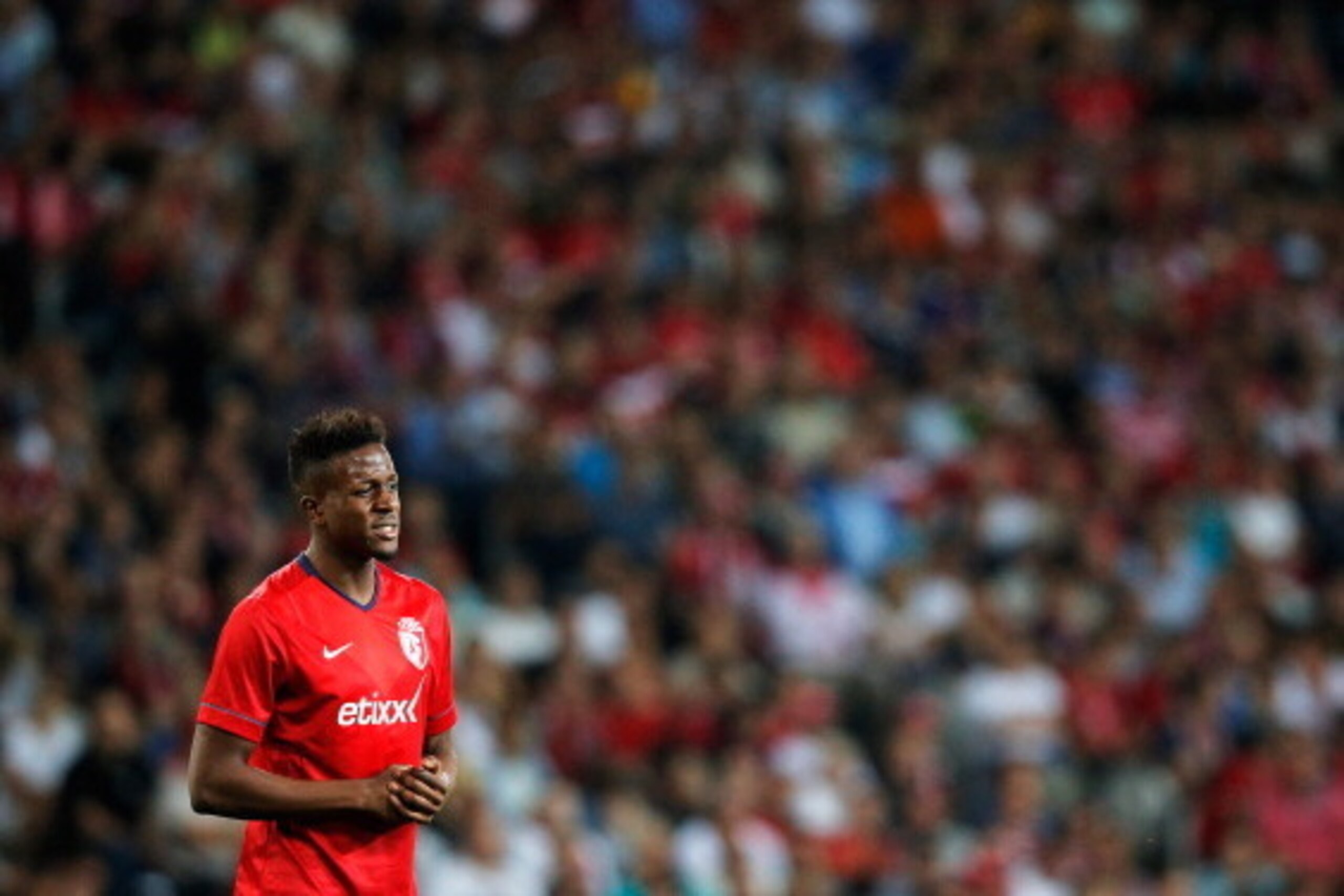 LILLE, FRANCE - AUGUST 05:  Divock Origi of Lille looks on during the UEFA Champions League third qualifying round 2nd leg match between LOSC Lille and Grasshopper Club Zurich at the Stade Pierre-Mauroy on August 5, 2014 in Lille, France.  (Photo by Dean 