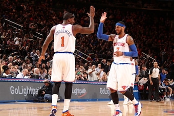 NEW YORK, NY - FEBRUARY 24: Carmelo Anthony #7 and Amar'e Stoudemire #1 of the New York Knicks celebrate during a game against the Dallas Mavericks at Madison Square Garden in New York City. NOTE TO USER: User expressly acknowledges and agrees that, by do