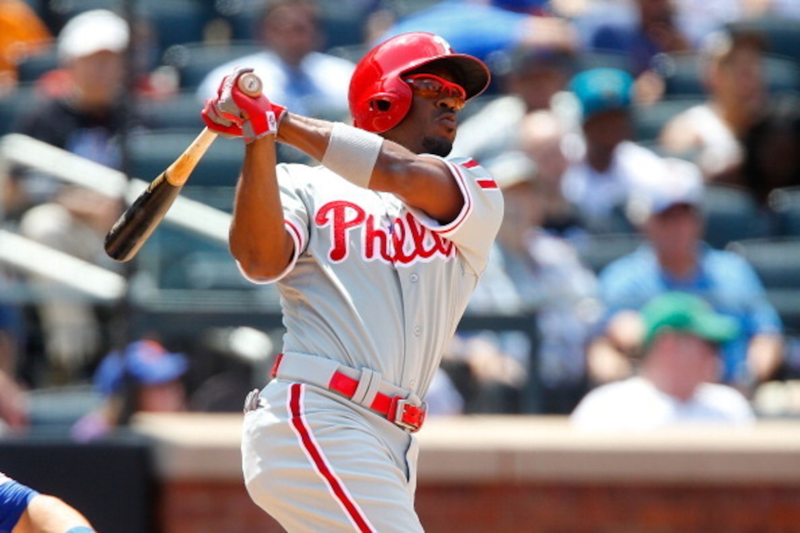 NEW YORK, NY - JULY 30:  Jimmy Rollins #11 of the Philadelphia Phillies follows through on a seventh inning pinch hit home run against the New York Mets at Citi Field on July 30, 2014 in the Flushing neighborhood of the Queens borough of New York City.  (