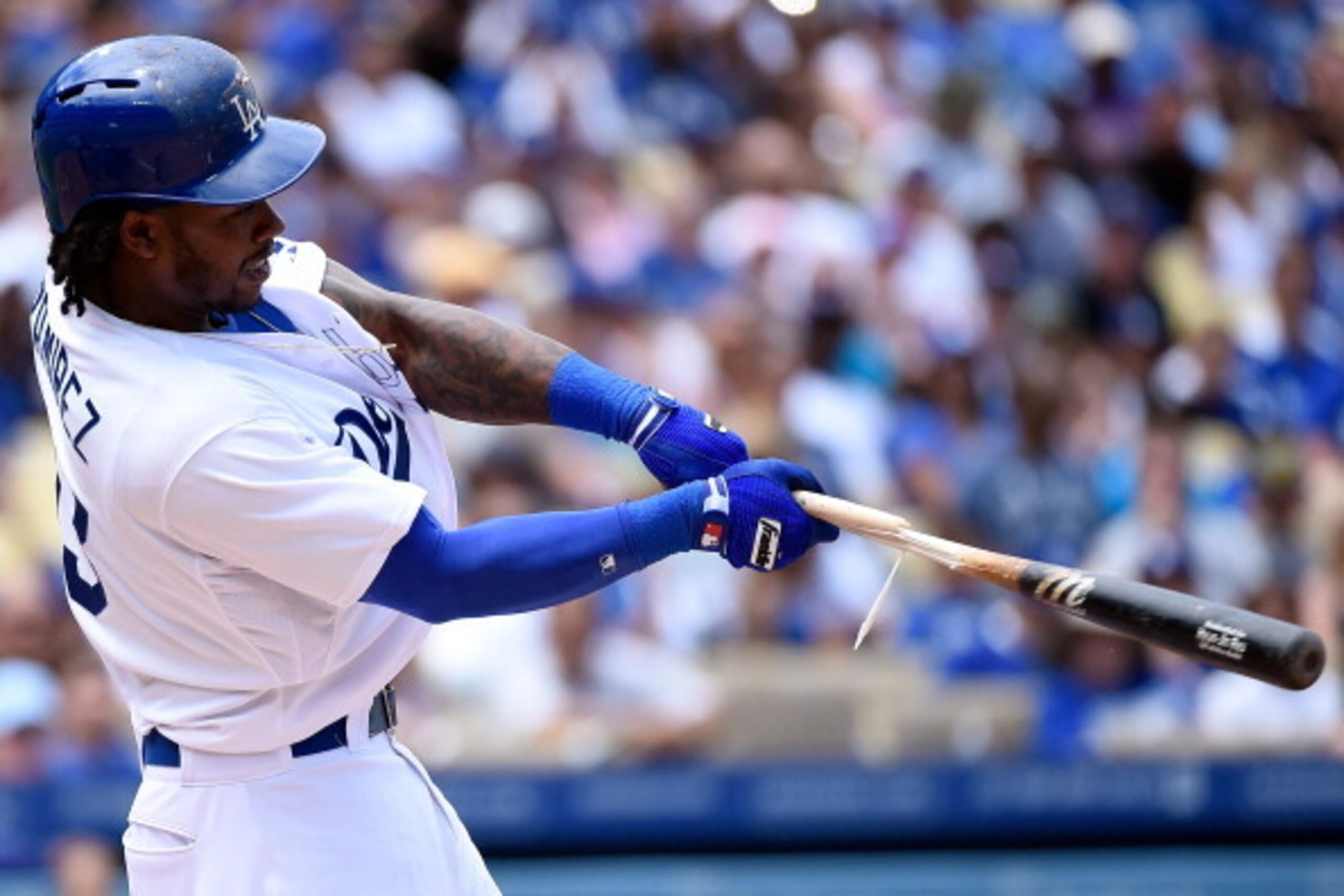 LOS ANGELES, CA - AUGUST 03:  Hanley Ramirez #13 of the Los Angeles Dodgers breaks his bat as he drives in a run in the first inning against the Chicago Cubs at Dodger Stadium on August 3, 2014 in Los Angeles, California.  (Photo by Lisa Blumenfeld/Getty 
