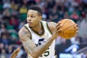 Jan 10, 2014; Salt Lake City, UT, USA; Utah Jazz shooting guard Brandon Rush (25) controls the ball during the second half against the Cleveland Cavaliers at EnergySolutions Arena. The Cavaliers won 113-102. Mandatory Credit: Russ Isabella-USA TODAY Sport