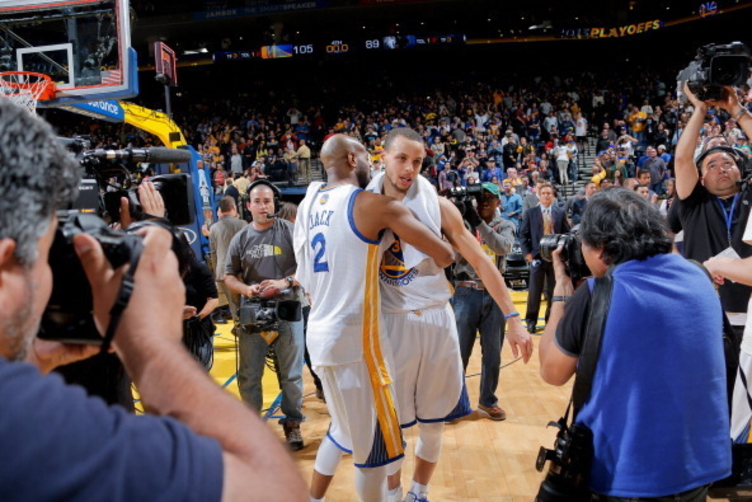 OAKLAND, CA - APRIL 9: Jarrett Jack #2 and Stephen Curry #30 of the Golden State Warriors celebrate after their team clinched a spot in the playoffs with a victory against the Minnesota Timberwolves on April 9, 2013 at Oracle Arena in Oakland, California.