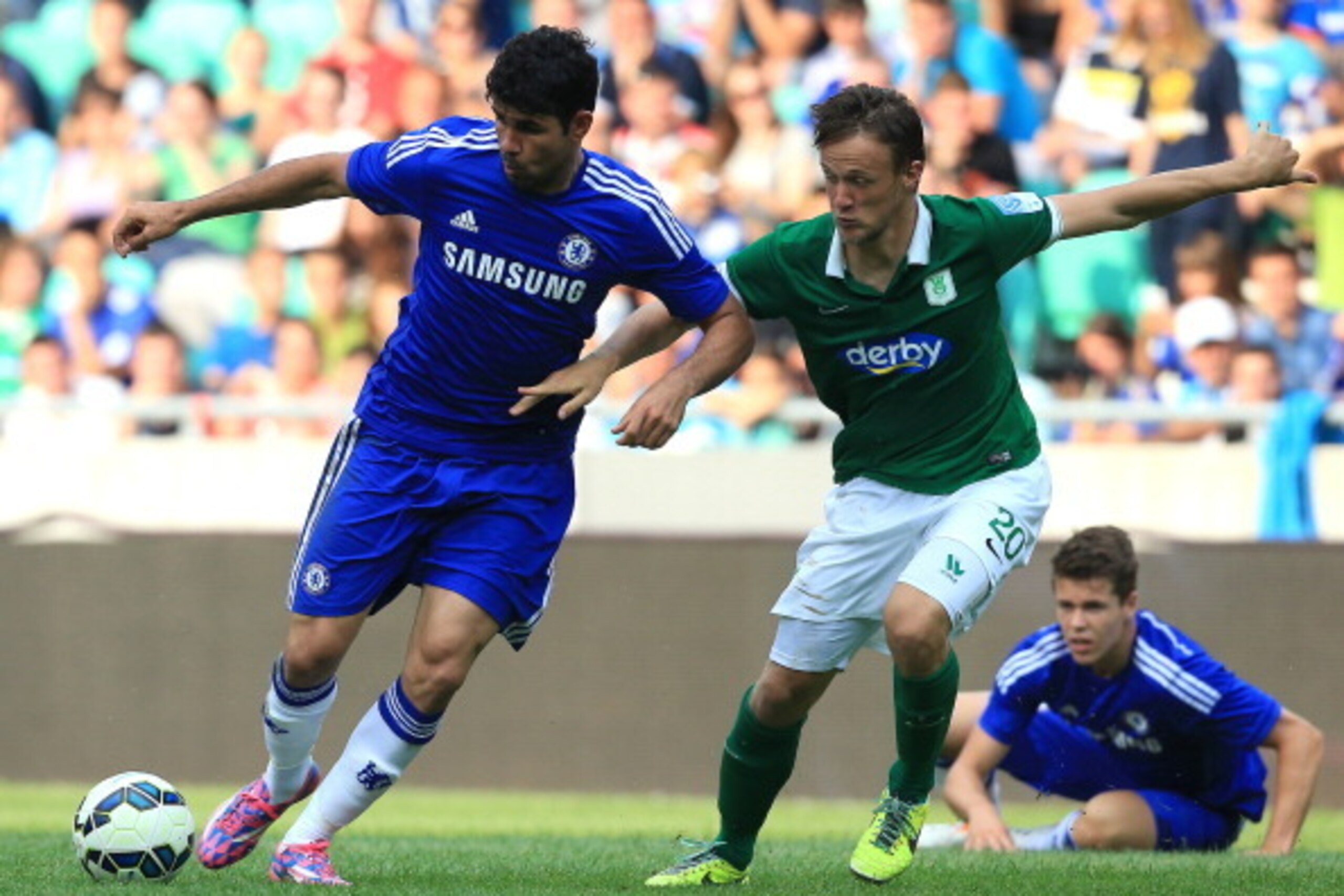 LJUBLJANA, SLOVENIA - JULY 27: Diego Costa (L) of Chelsea in action against Antonio Mlinar Delamea (L) of FC Olimpija Ljubljana during the Pre Season Friendly  match between FC Olimpija Ljubljana and Chelsea at Stozice stadium in Ljubljana, Slovenia on Su