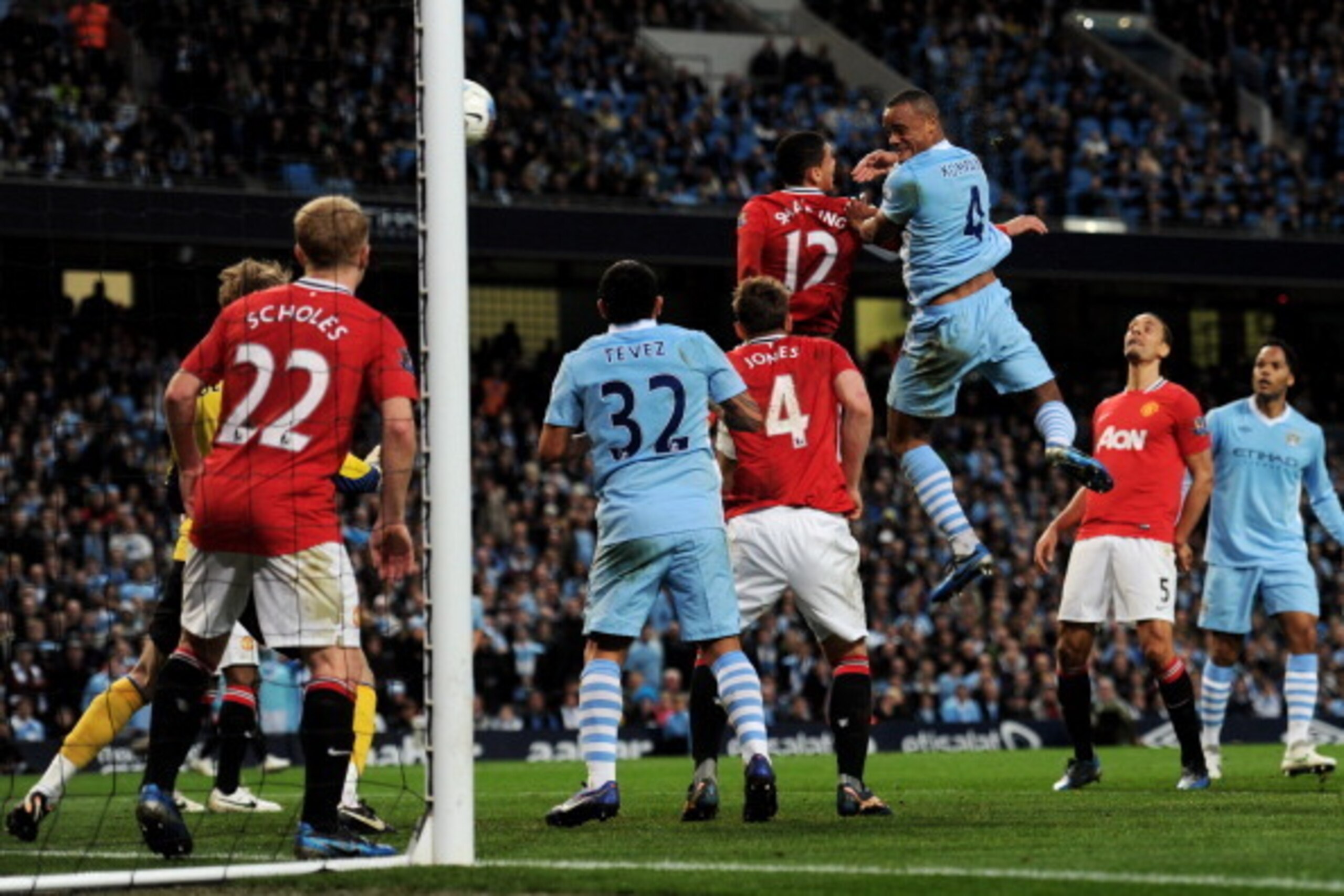 MANCHESTER, ENGLAND - APRIL 30:  Vincent Kompany of Manchester City scores the opening goal during the Barclays Premier League match between Manchester City and Manchester United at the Etihad Stadium on April 30, 2012 in Manchester, England.  (Photo by M