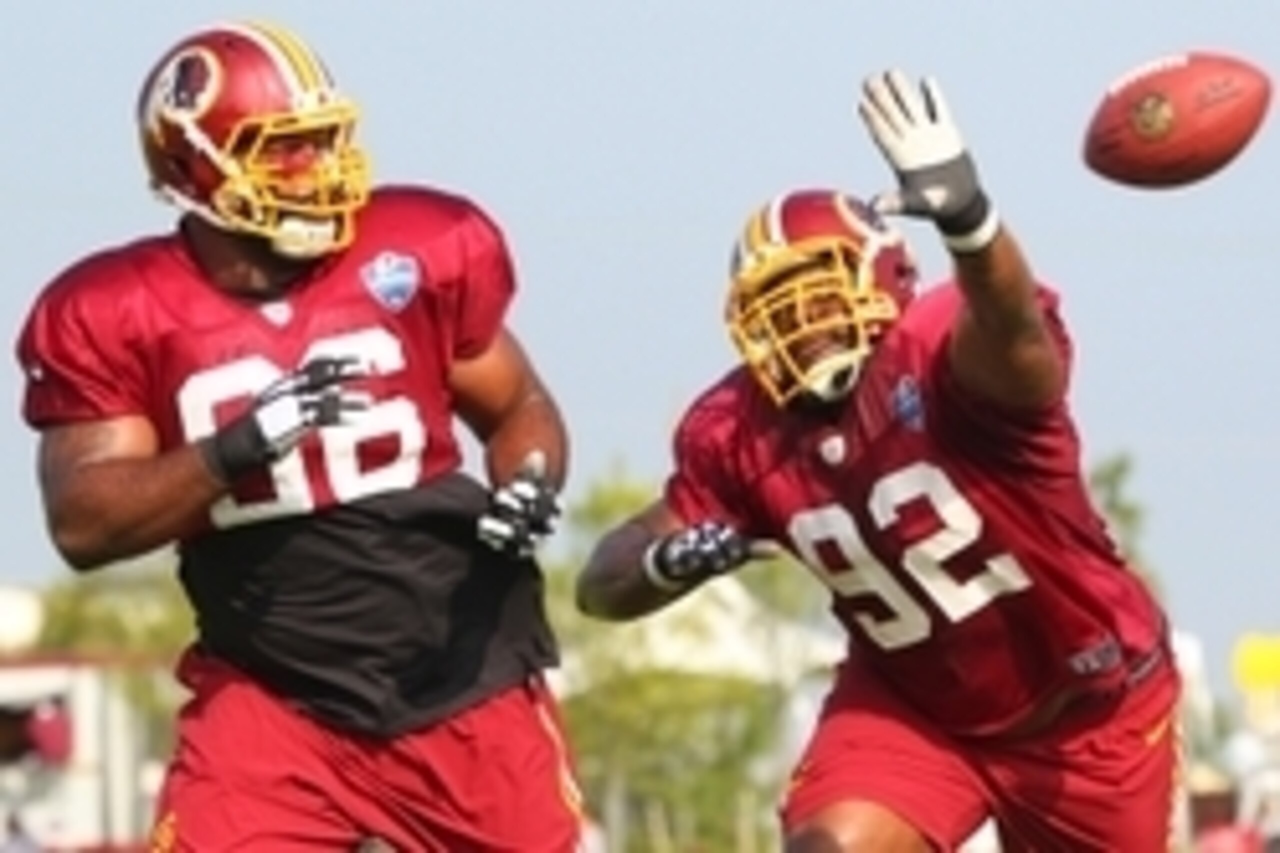 Jul 25, 2014; Richmond, VA, USA; Washington Redskins nose tackle Barry Cofield (96) and Redskins defensive end Chris Baker (92) participate in drills during practice on day three of training camp at Bon Secours Washington Redskins Training Center. Mandato