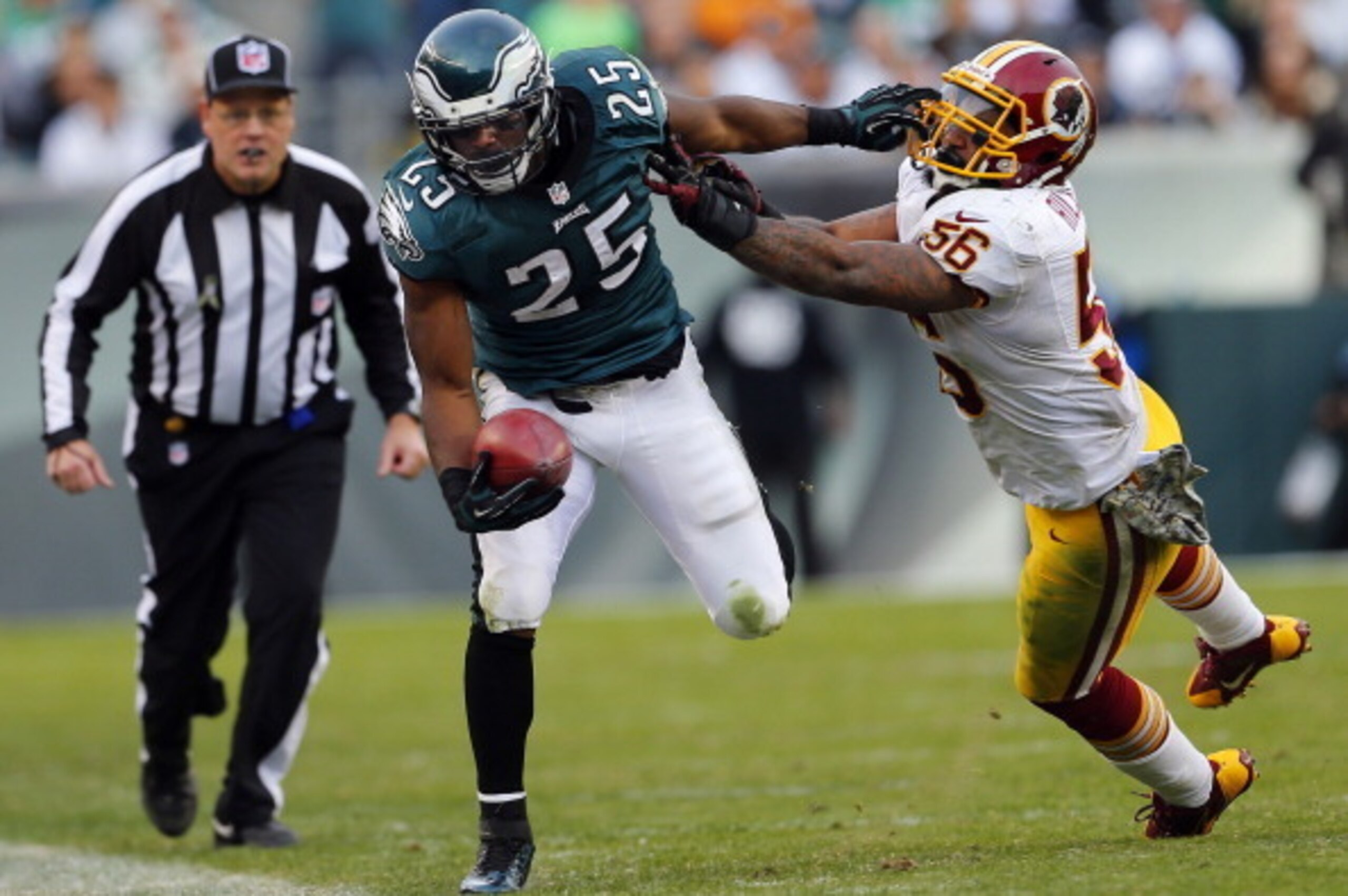 PHILADELPHIA, PA - NOVEMBER 17: Running back LeSean McCoy #25 of the Philadelphia Eagles is pushed out of bounds by linebacker Perry Riley #56 of the Washington Redskins during the third quarter in a game at Lincoln Financial Field on November 17, 2013 in
