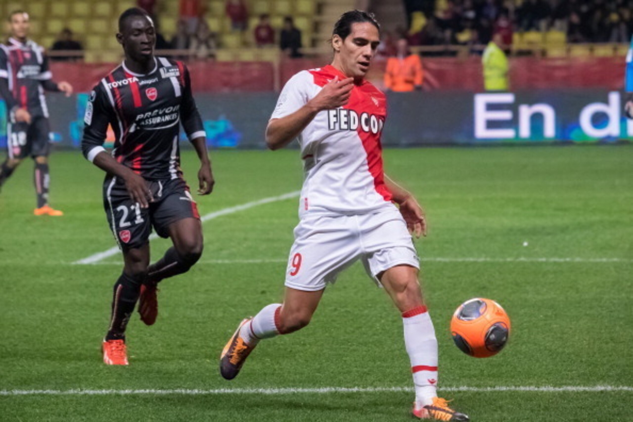 MONTE-CARLO, MONACO - DECEMBER 20:  Monaco's foward Radamel Falcao (R) challenges Valenciennes's defender Saliou Ciss (L)  during the French L1 football match between AS Monaco vs Valenciennes at Louis II Stadium on December 20, 2013 in Monte-Carlo, Monac