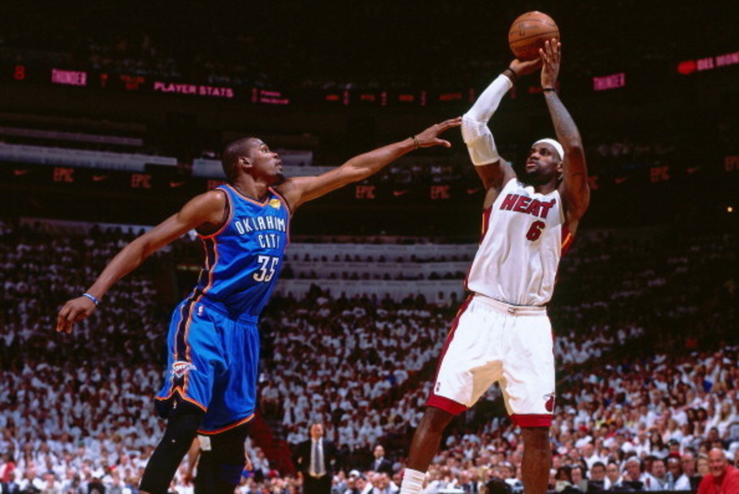 MIAMI, FL - JUNE 21: LeBron James shoots the ball against Kevin Durant #35 of the Oklahoma City Thunder during Game Five of the 2012 NBA Finals at American Airlines Arena on June 21, 2012 in Miami, Florida. NOTE TO USER: User expressly acknowledges and a MIAMI, FL - JUNE 21: LeBron James shoots the ball against Kevin Durant #35 of the Oklahoma City Thunder during Game Five of the 2012 NBA Finals at American Airlines Arena on June 21, 2012 in Miami, Florida. NOTE TO USER: User expressly acknowledges and a