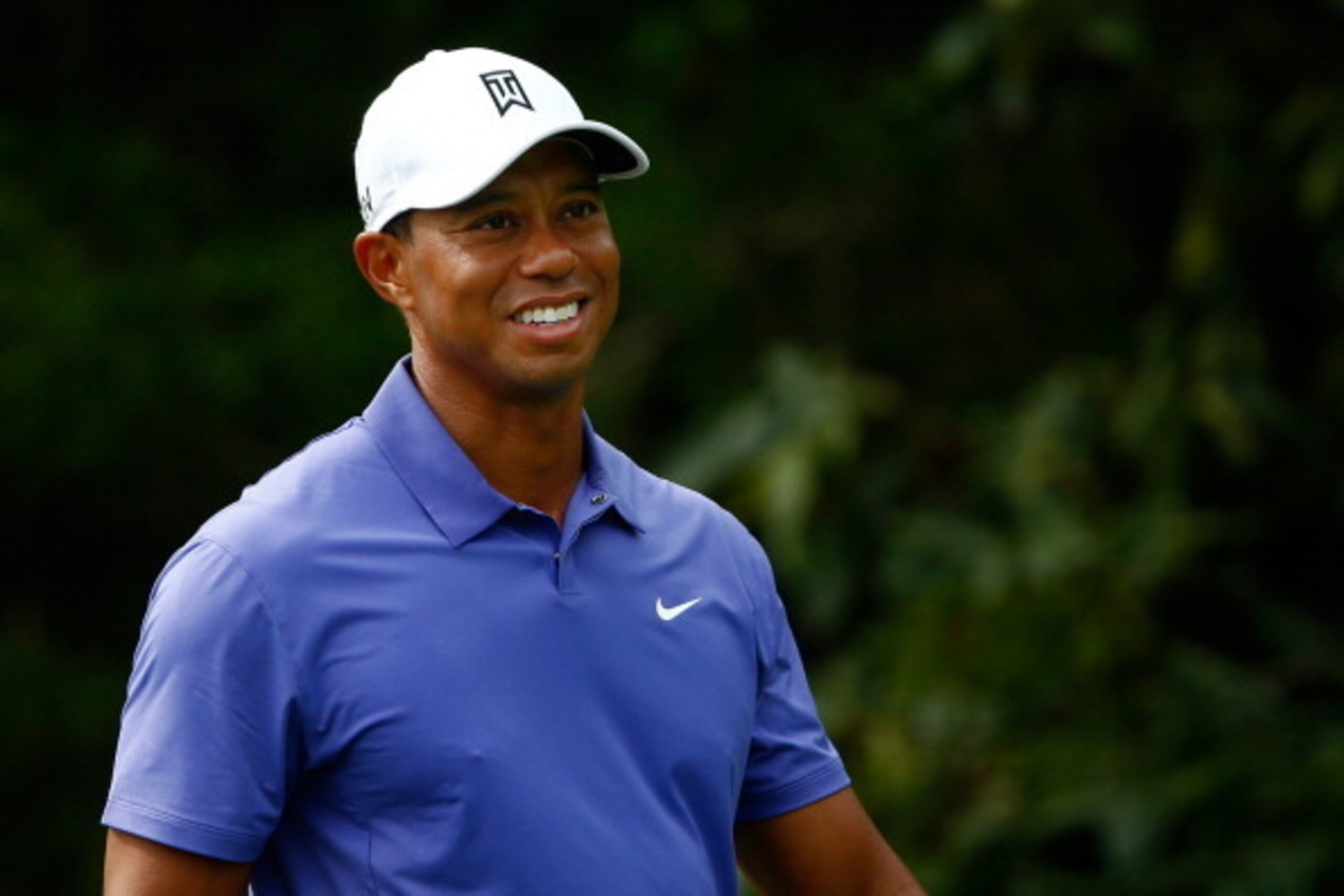 LOUISVILLE, KY - AUGUST 07:  Tiger Woods of the United States smiles on the 18th tee during the first round of the 96th PGA Championship at Valhalla Golf Club on August 7, 2014 in Louisville, Kentucky.  (Photo by Sam Greenwood/Getty Images)