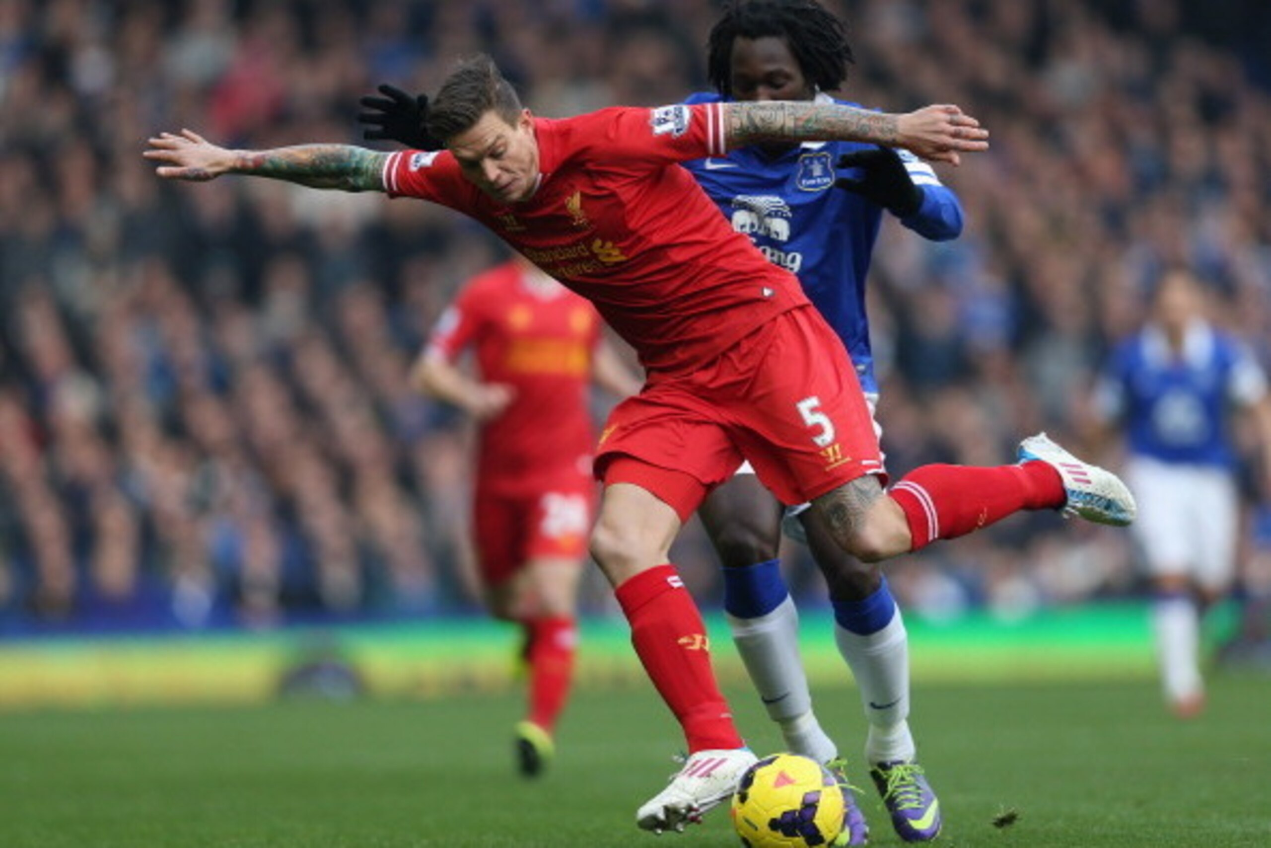LIVERPOOL, ENGLAND - NOVEMBER 23: Daniel Agger of Liverpool competes with Romelu Lukaku of Everton during the Barclays Premier League match between Everton and Liverpool at Goodison Park on November 23, 2013 in Liverpool, England. (Photo by Clive Brunsk LIVERPOOL, ENGLAND - NOVEMBER 23: Daniel Agger of Liverpool competes with Romelu Lukaku of Everton during the Barclays Premier League match between Everton and Liverpool at Goodison Park on November 23, 2013 in Liverpool, England. (Photo by Clive Brunsk