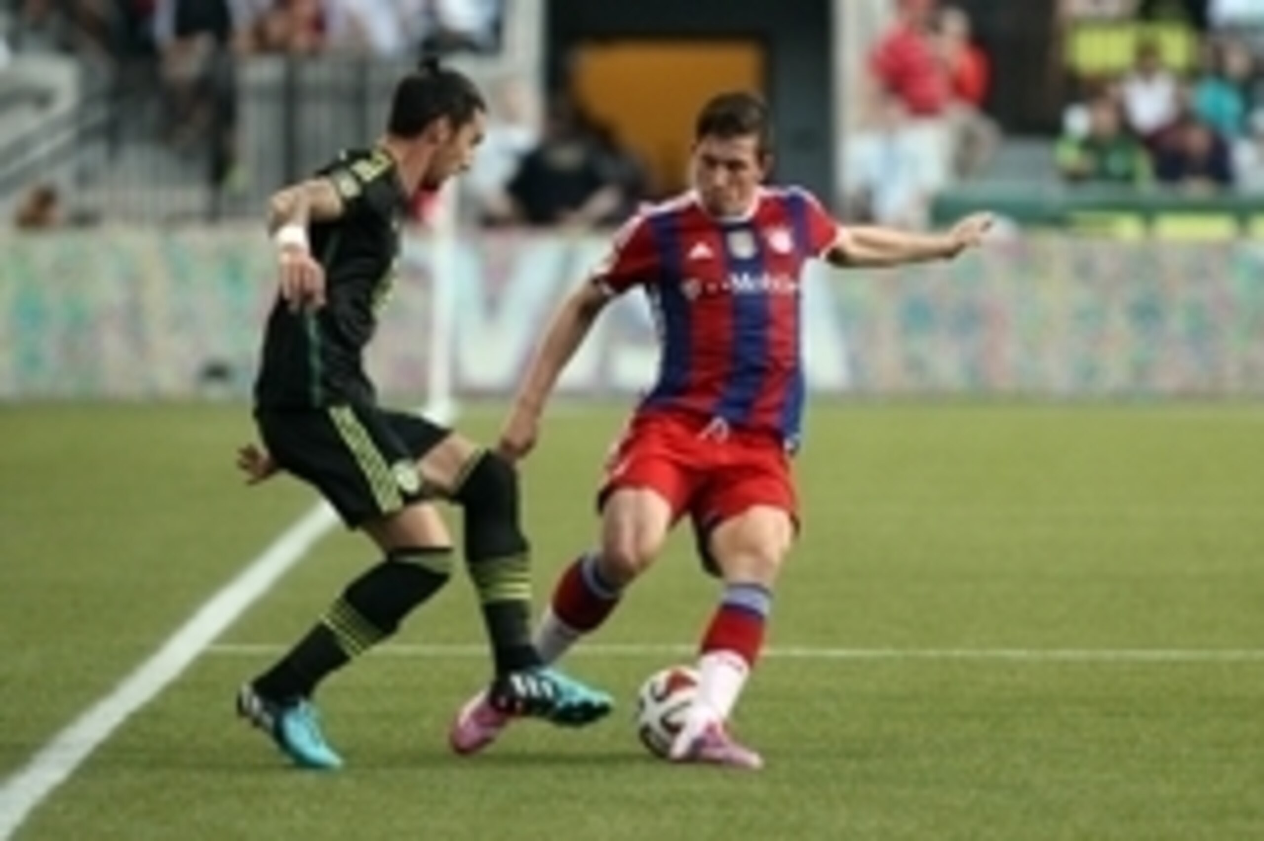 Aug 6, 2014; Portland, OR, USA; MLS All Stars defenseman Liam Ridgewell (24) of the Portland Timbers battles for the ball with Bayern Munich midfielder Pierre Hojbjerg (34) during the 2014 MLS All Star Game at Providence Park. Mandatory Credit: Jaime Vald Aug 6, 2014; Portland, OR, USA; MLS All Stars defenseman Liam Ridgewell (24) of the Portland Timbers battles for the ball with Bayern Munich midfielder Pierre Hojbjerg (34) during the 2014 MLS All Star Game at Providence Park. Mandatory Credit: Jaime Vald