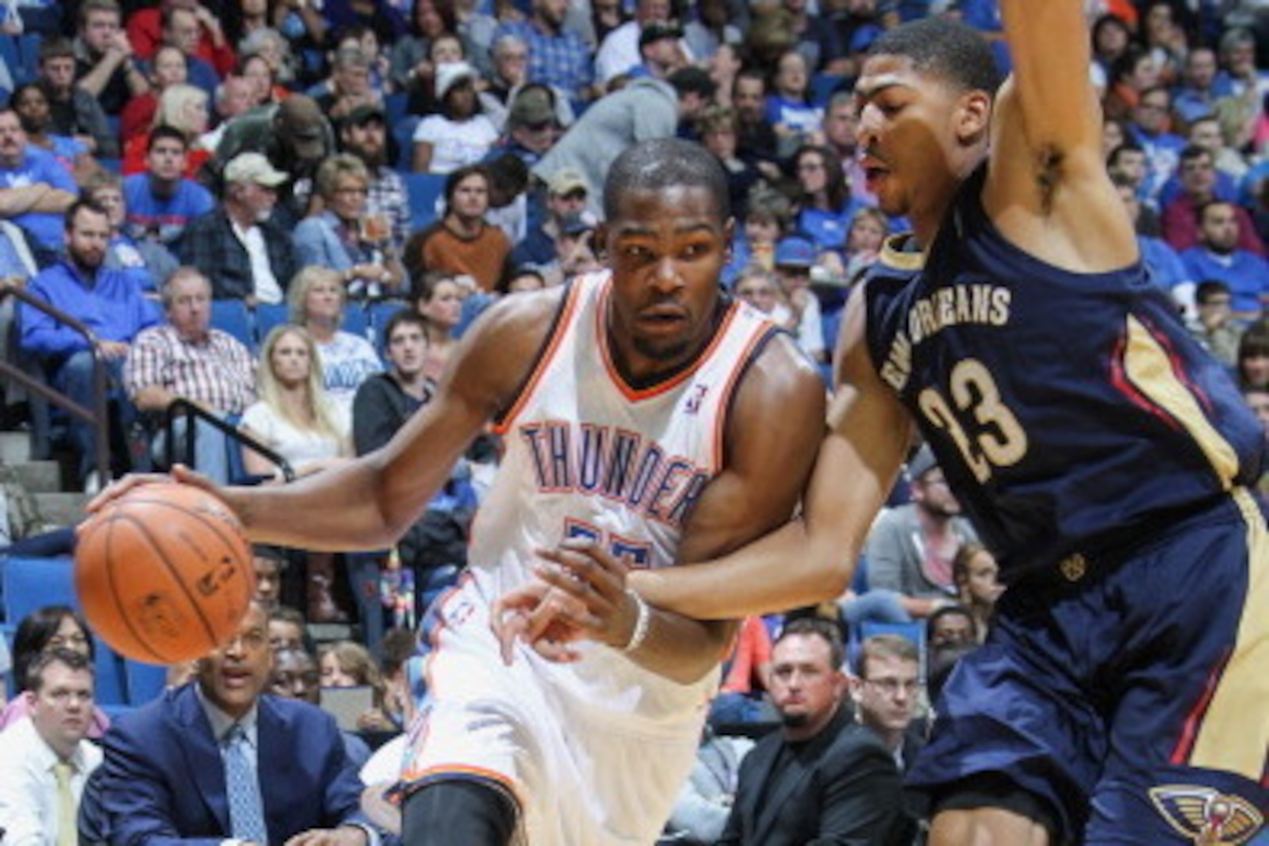 TULSA, OK - OCTOBER 17:  Kevin Durant #35 of the Oklahoma City Thunder drives to the basket against Anthony Davis #23 of the New Orleans Pelicans on October 17, 2013 at the BOK Center in Tulsa, Oklahoma. NOTE TO USER: User expressly acknowledges and agree