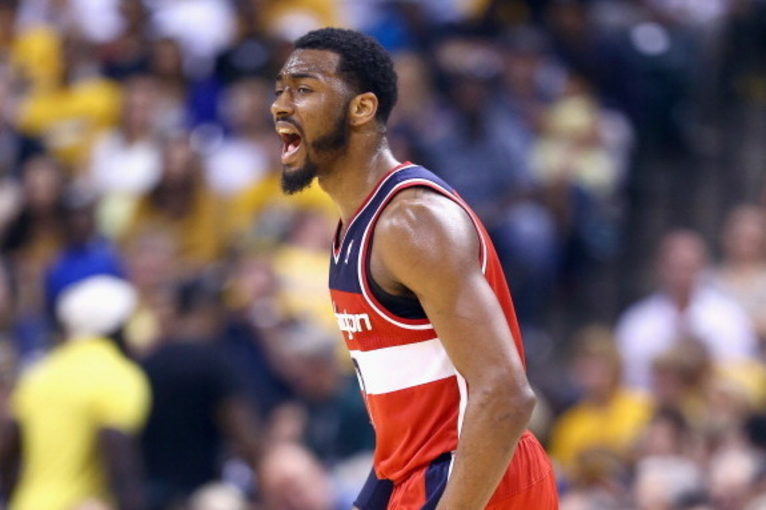 INDIANAPOLIS, IN - MAY 13:  John Wall #2 of the Washington Wizards celebrates in the 102-79 win over the Indiana Pacers in Game 5 of the Eastern Conference Semifinals during the 2014 NBA Playoffs at Bankers Life Fieldhouse on May 13, 2014 in Indianapolis,