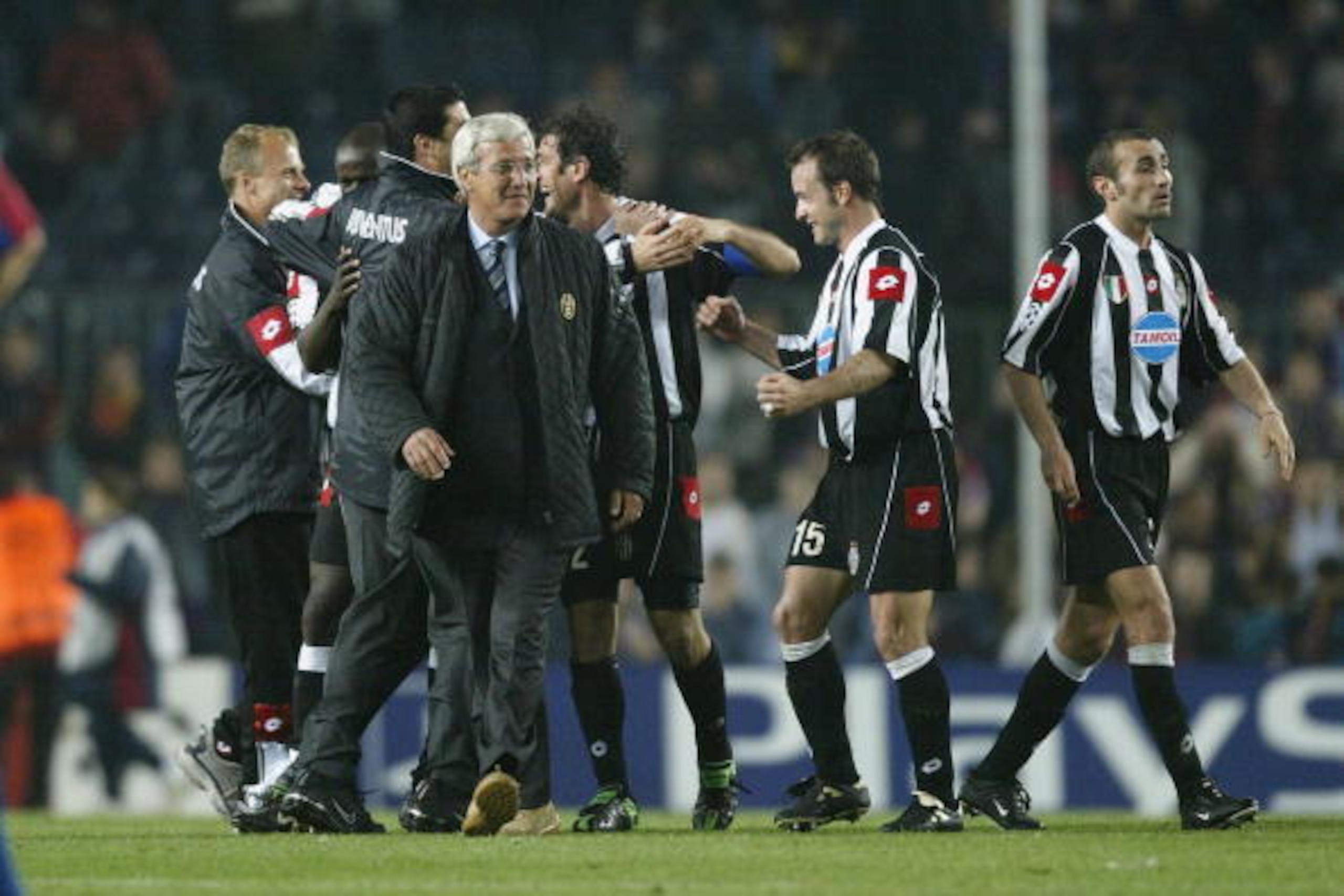 BARCELONA - APRIL 22:  Marcello Lippi the coach of Juventus and players celebrate winning the UEFA Champions League Quarter-Final second leg match between Barcelona and Juventus at the Nou Camp Stadium on April 22, 2003 in Barcelona, Spain. (Photo by Alex