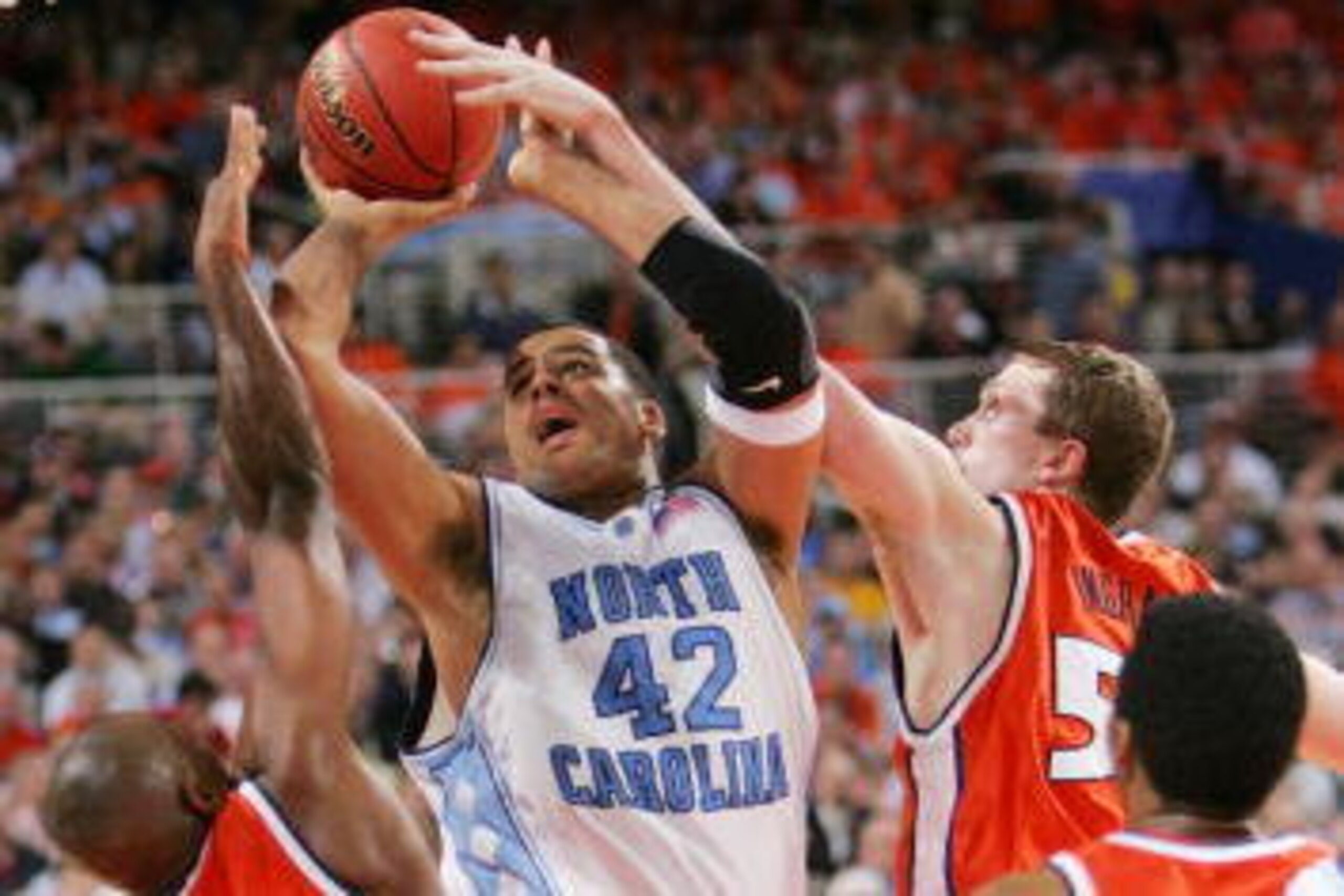 ST. LOUIS - APRIL 04:  Sean May #42 of the North Carolina Tar Heels fends off the Illinois Fighting Illini defense in the second half during the NCAA Men's National Championship game at the Edward Jones Dome on April 4, 2005 in St. Louis, Missouri.  (Phot